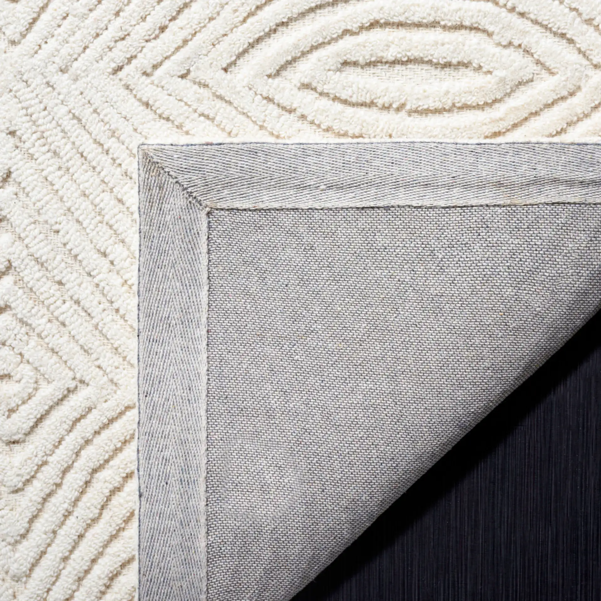 Textural Modern Concentric Diamond Hand-Tufted Wool Rug in Ivory in a styled room