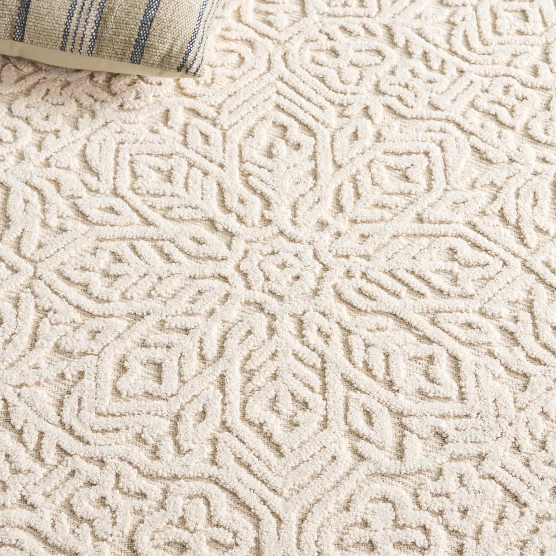 Textural Bohemian Medallion Hand-Tufted Wool Rug in Ivory in a styled room