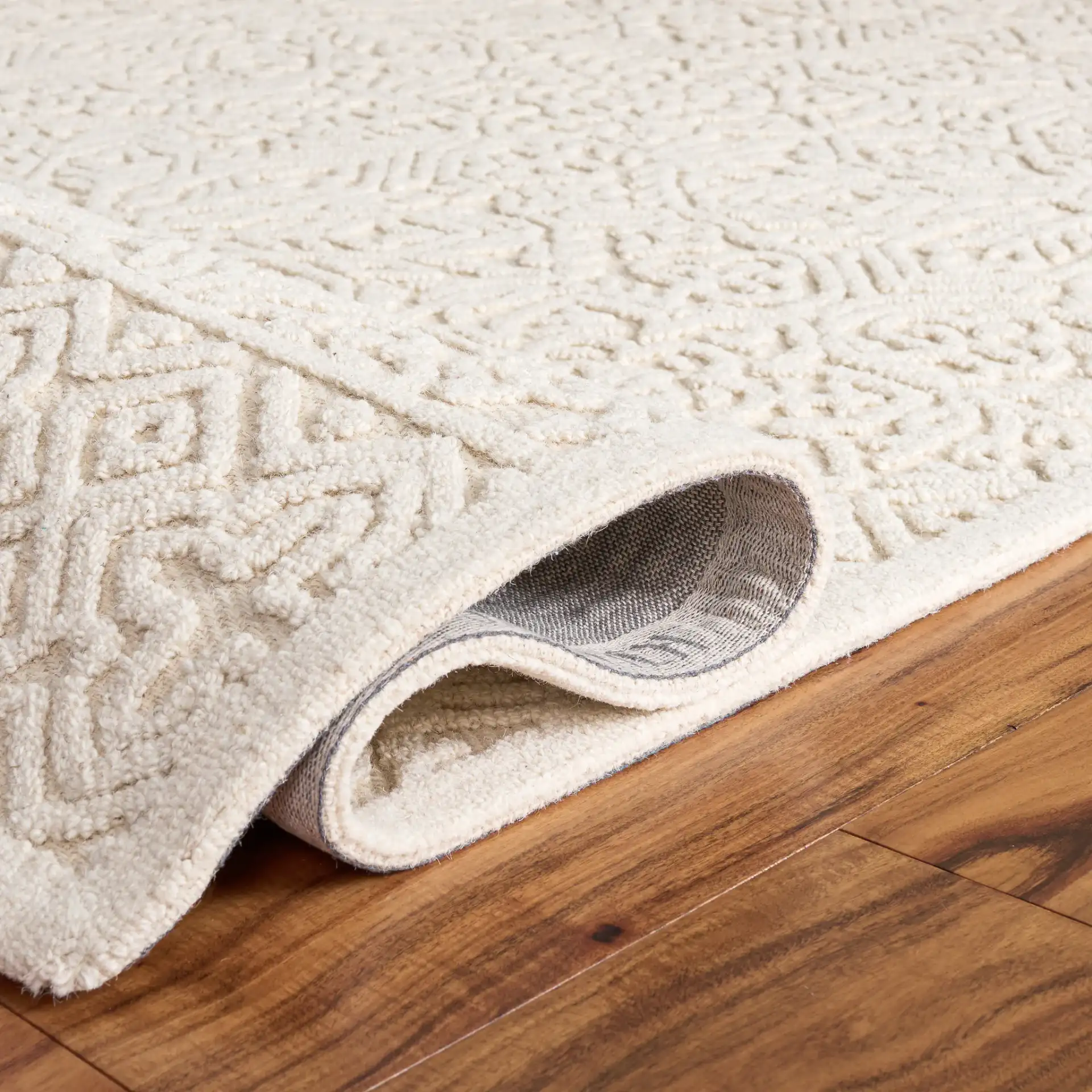 Textural Bohemian Medallion Hand-Tufted Wool Rug in Ivory in a styled room