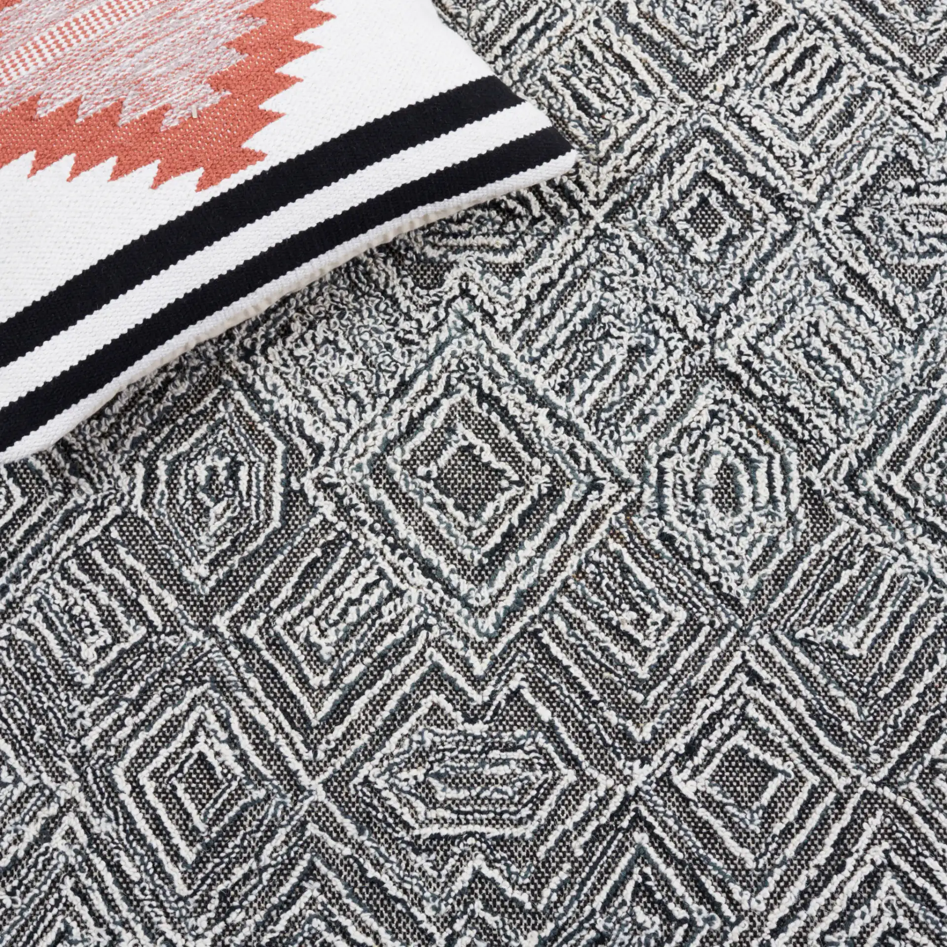 Textural Textual Nested Diamond Hand-Tufted Wool Rug in Black / Ivory in a styled room