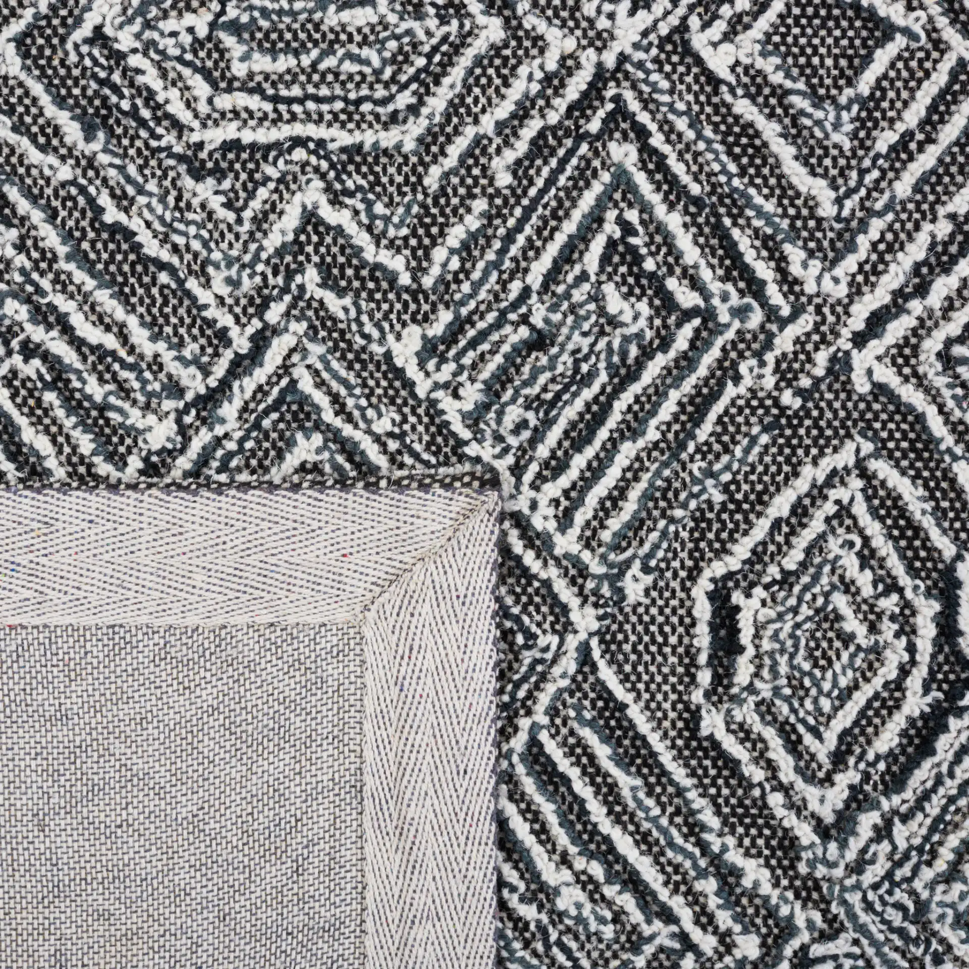 Textural Textual Nested Diamond Hand-Tufted Wool Rug in Black / Ivory in a styled room