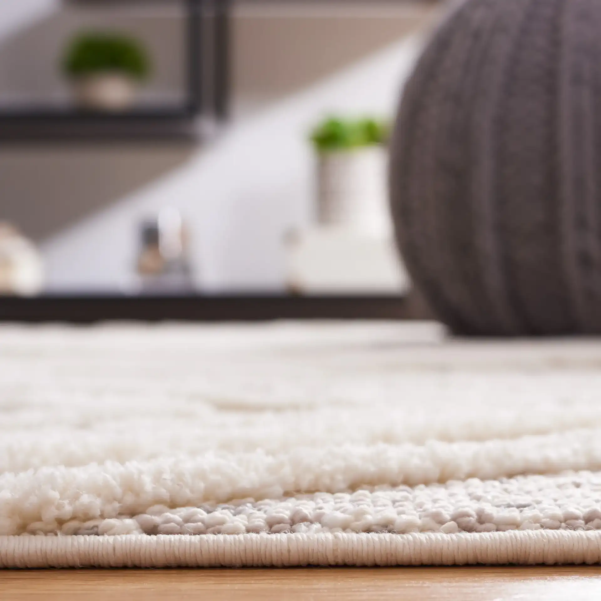 Urban Bohemian Diamond Grid Rug in Gray / Ivory in a styled room