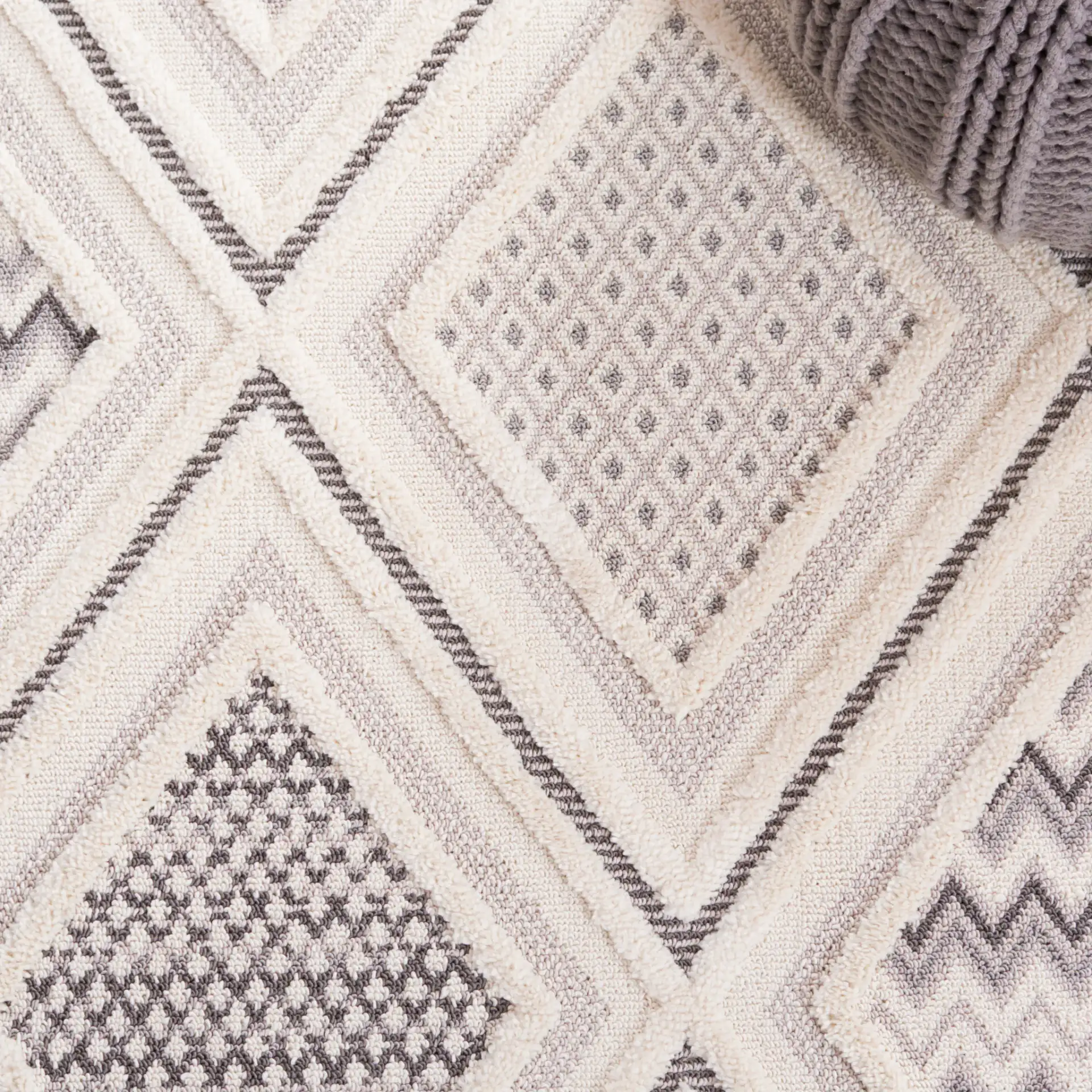 Urban Bohemian Diamond Grid Rug in Gray / Ivory in a styled room