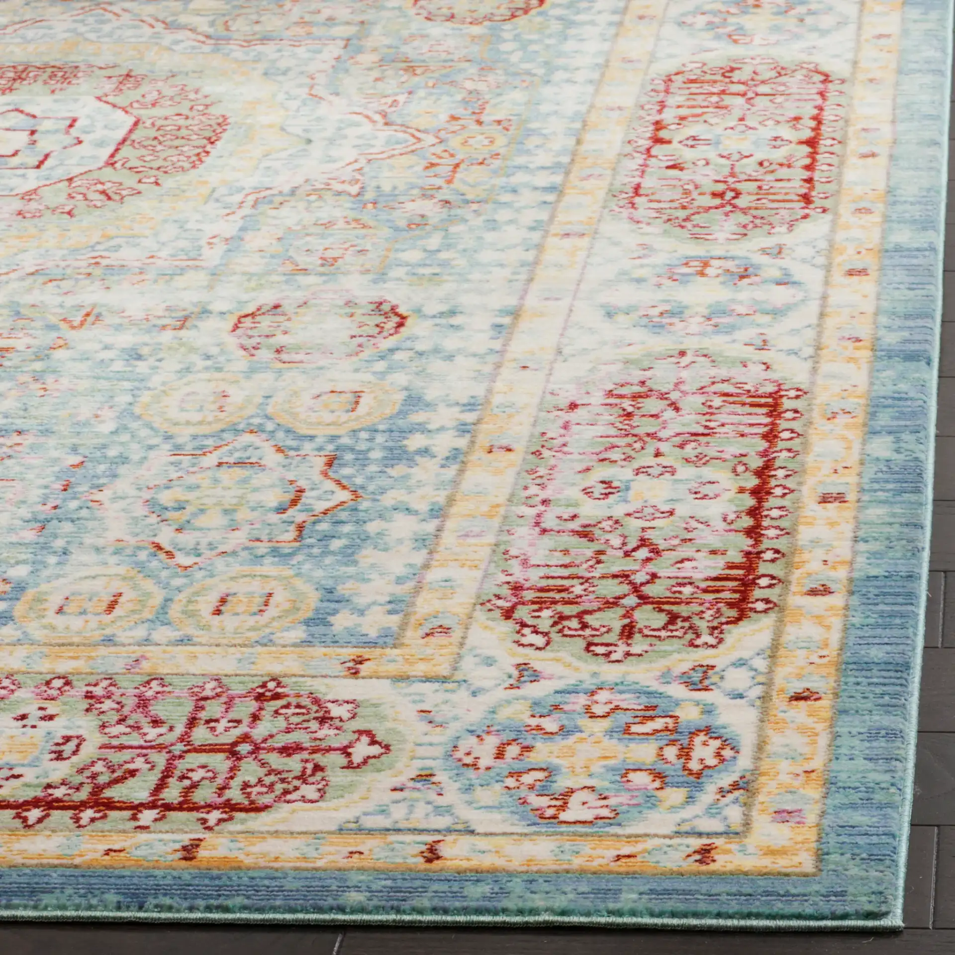 Valencia Medallion Rug in Blue / Multicolor in a styled room