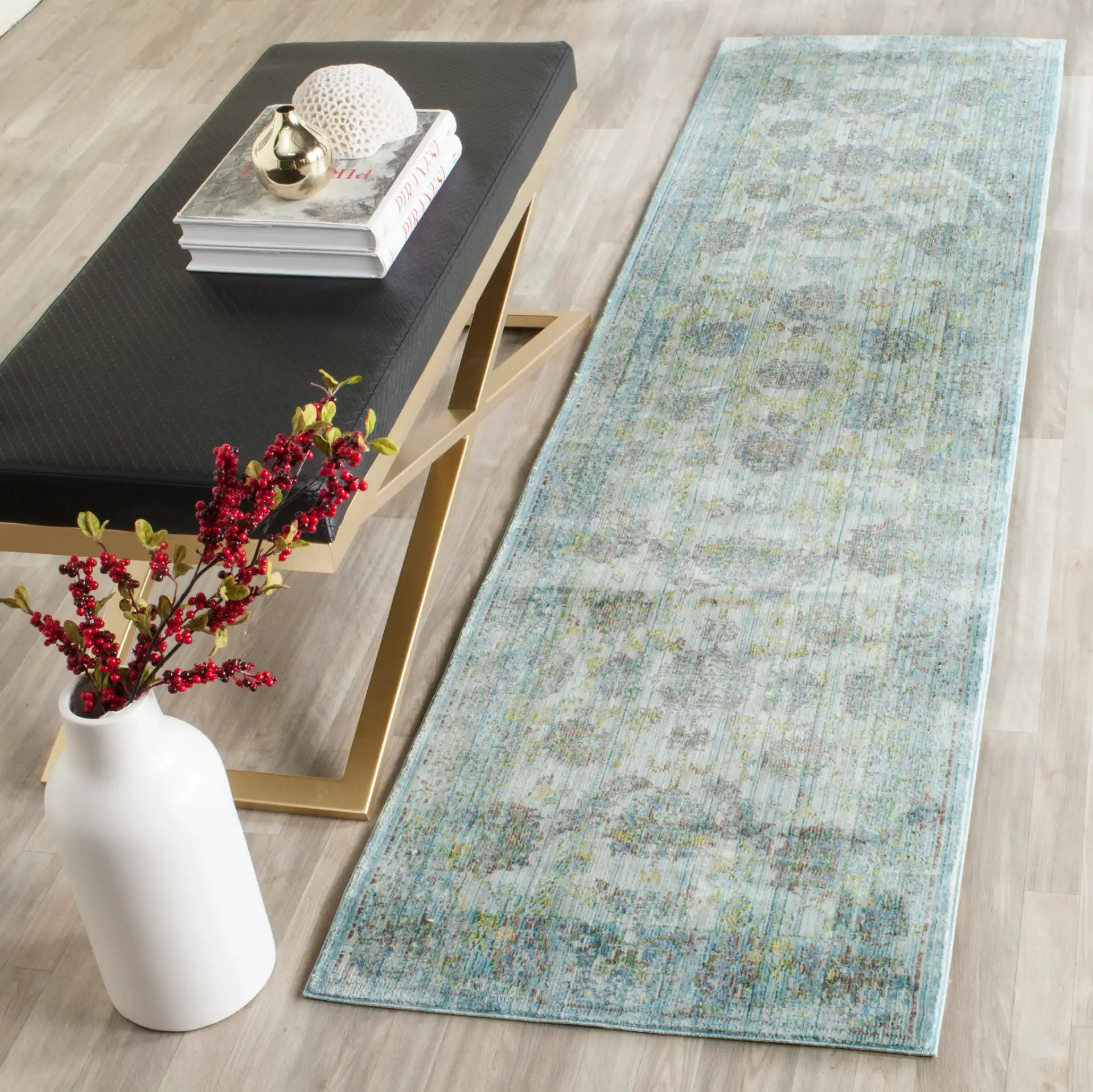Valencia Floral Scroll Bordered Rug in Light Blue / Turquoise in a styled room