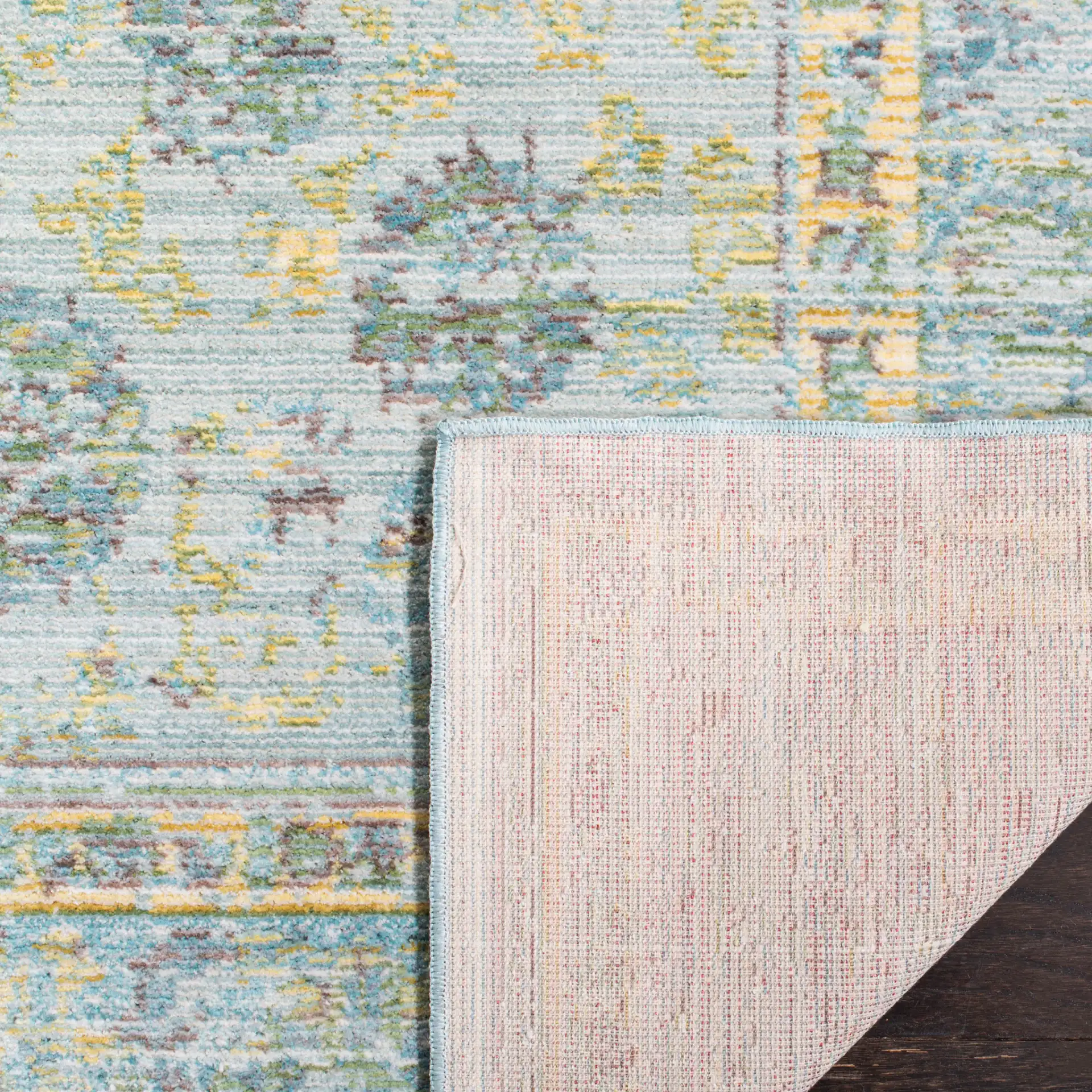 Valencia Floral Scroll Bordered Rug in Light Blue / Turquoise in a styled room