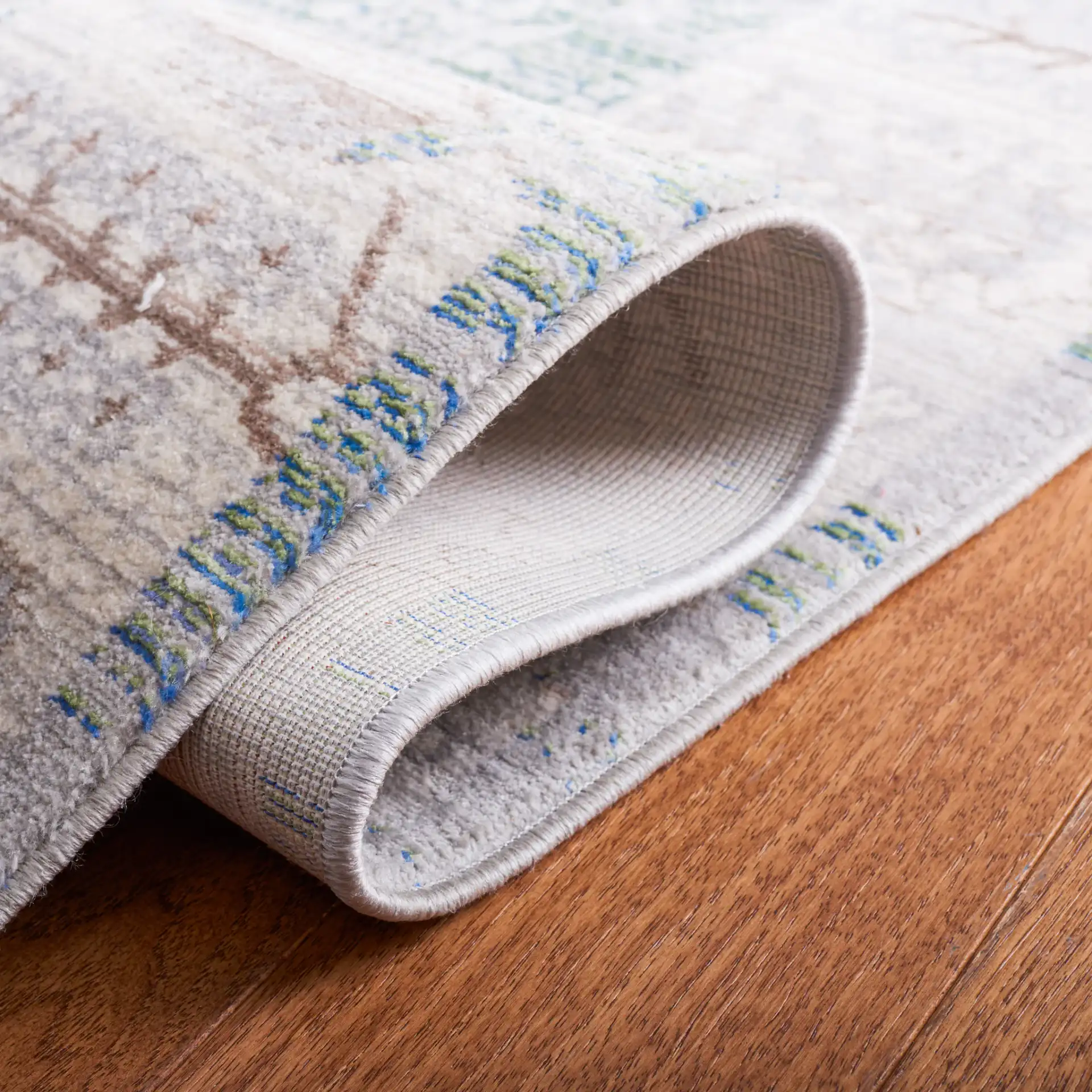 Valencia Botanical Bordered Rug in Gray / Green in a styled room