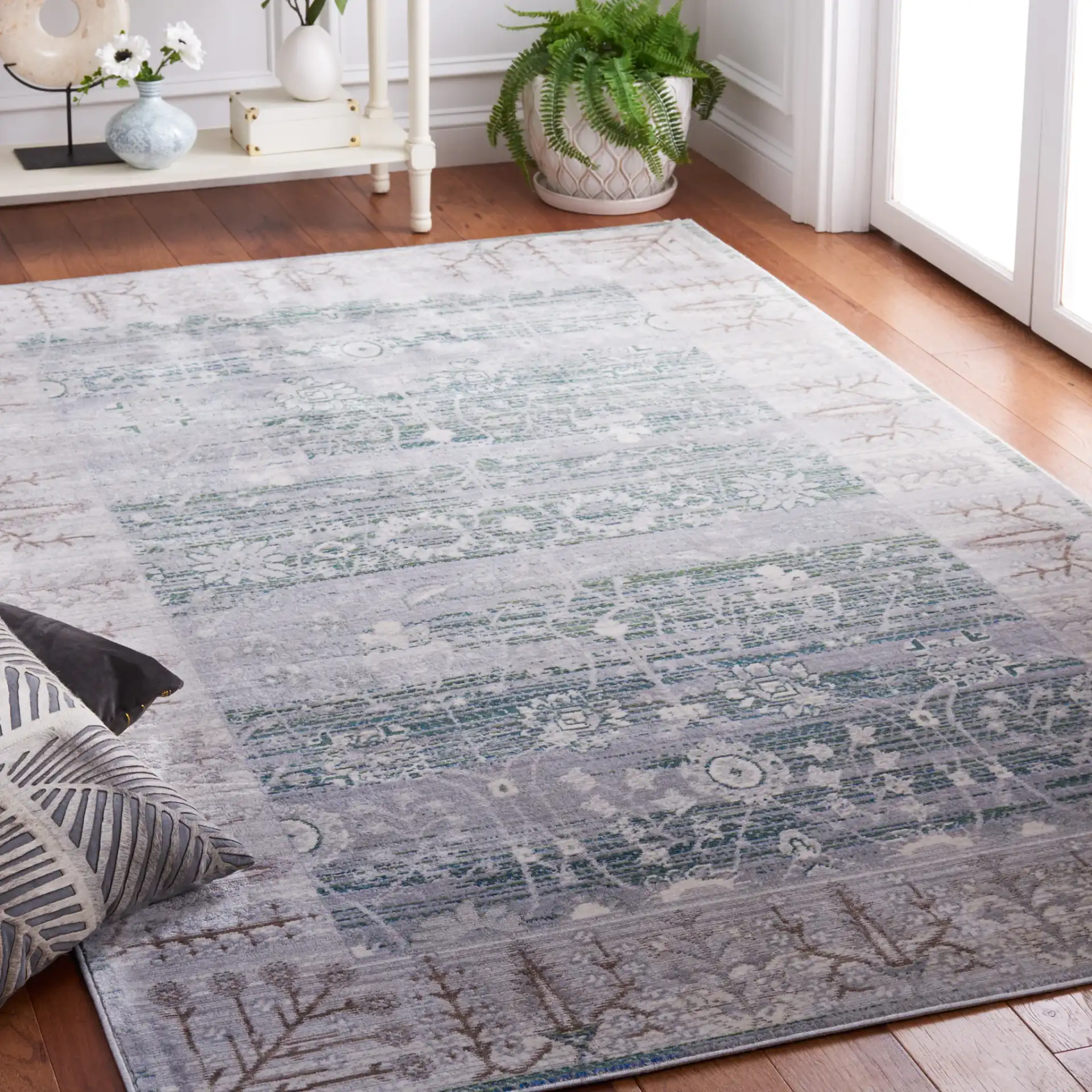 Valencia Botanical Bordered Rug in Gray / Green in a styled room