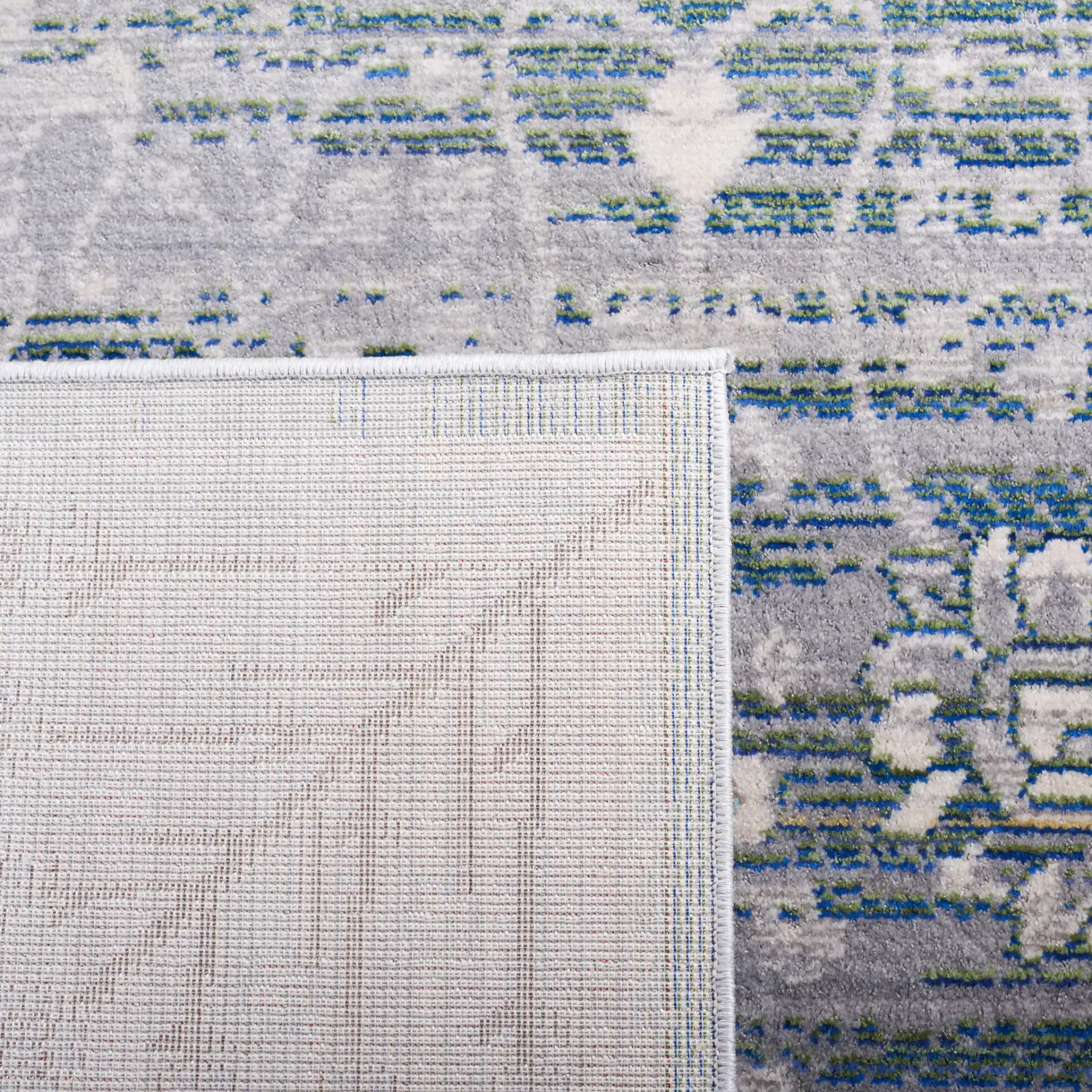 Valencia Botanical Bordered Rug in Gray / Green in a styled room