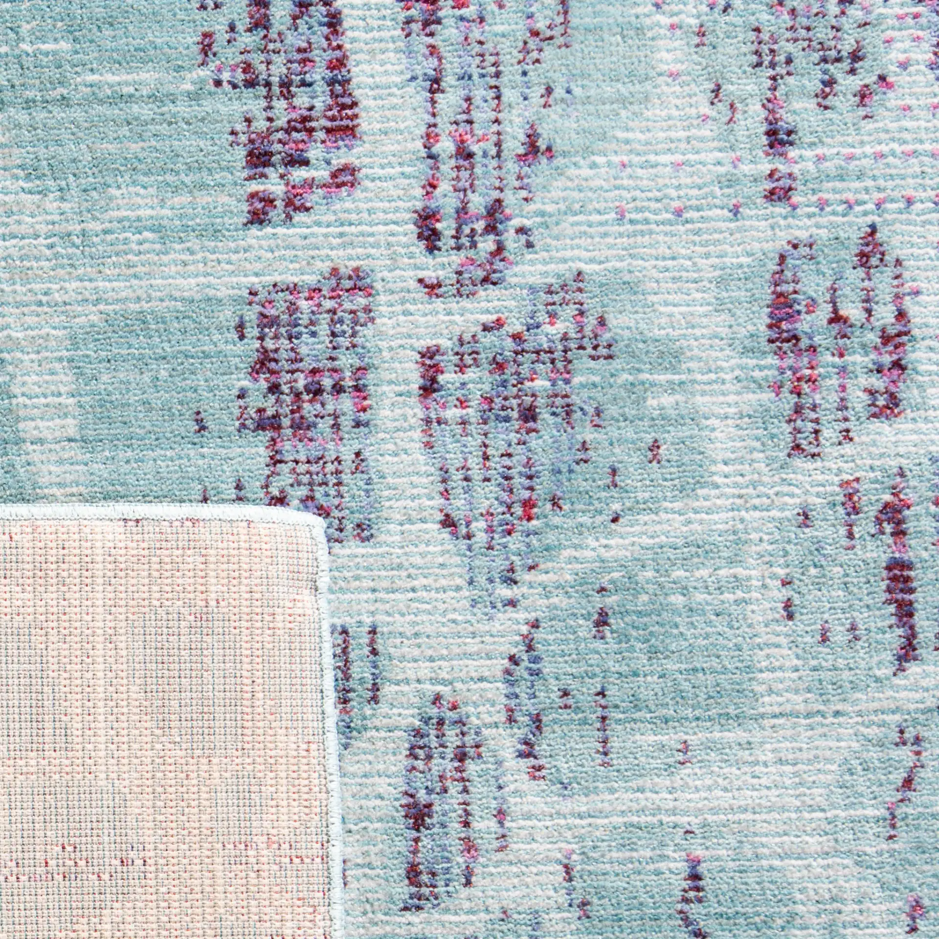 Valencia Cellular Abstract Rug in Blue / Fuchsia in a styled room