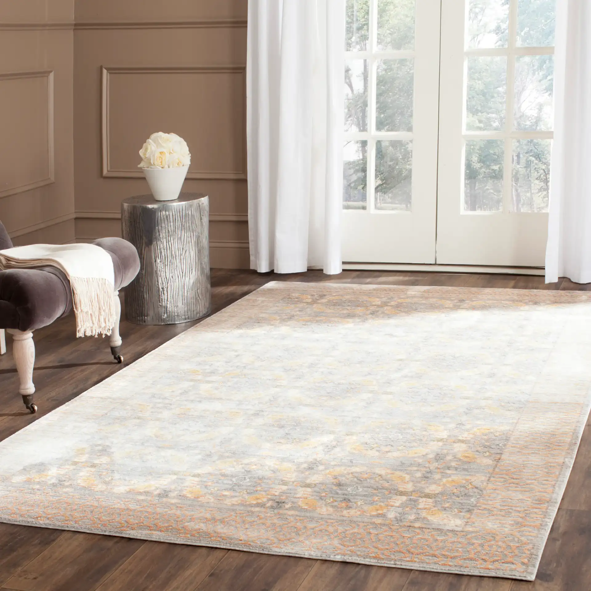 Valencia Bordered Medallion Rug in Light Gray / Multicolor in a styled room