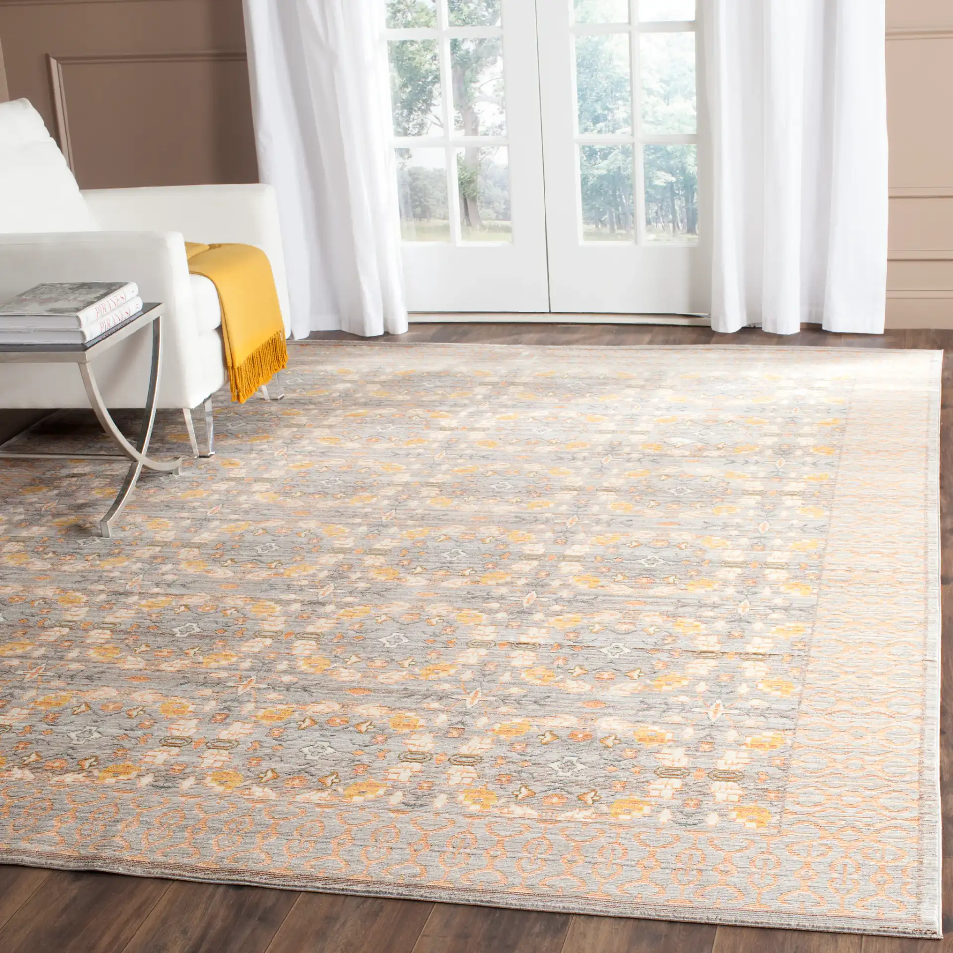 Valencia Bordered Medallion Rug in Light Gray / Multicolor in a styled room