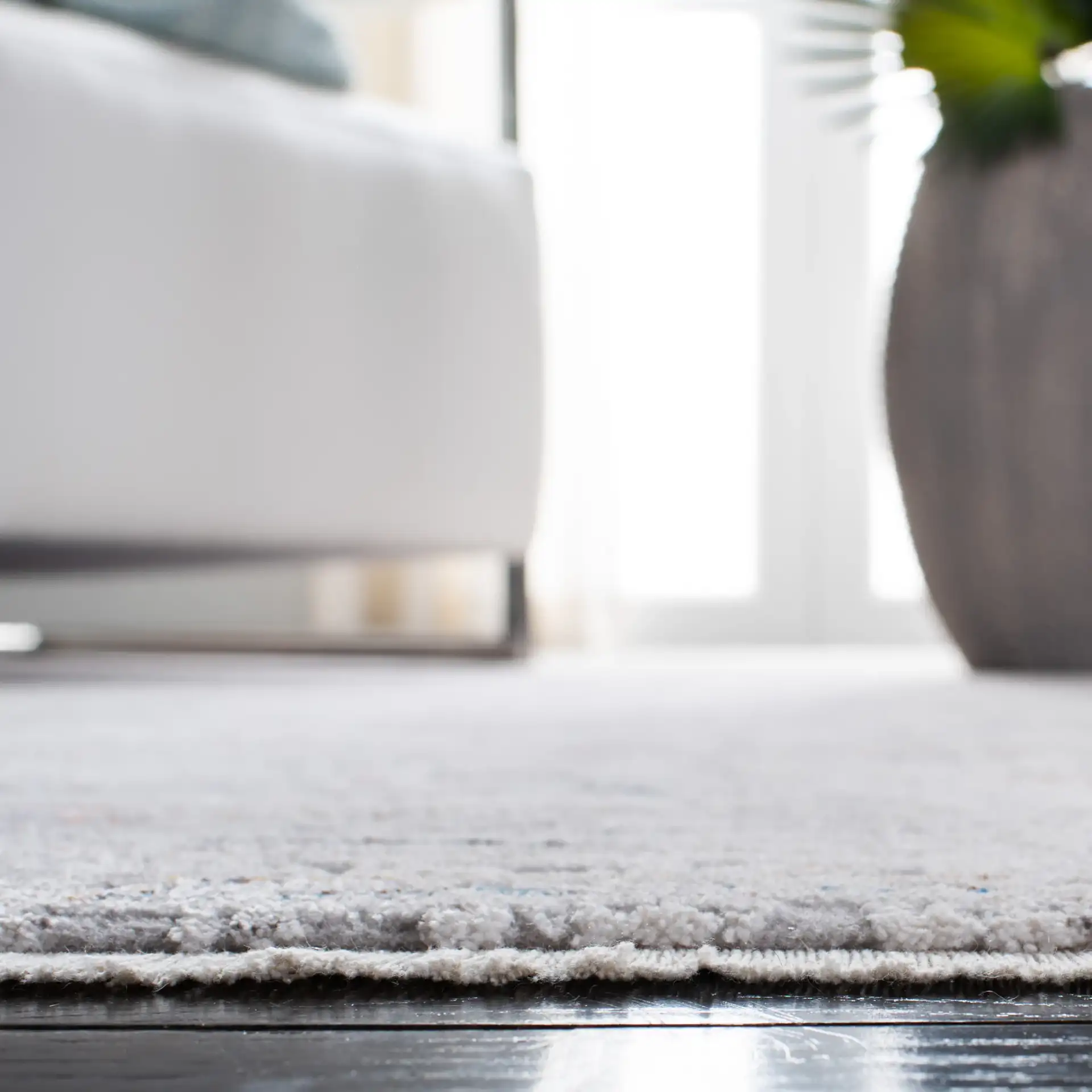 Valencia Abstract Linear Rug in Gray / Blue in a styled room