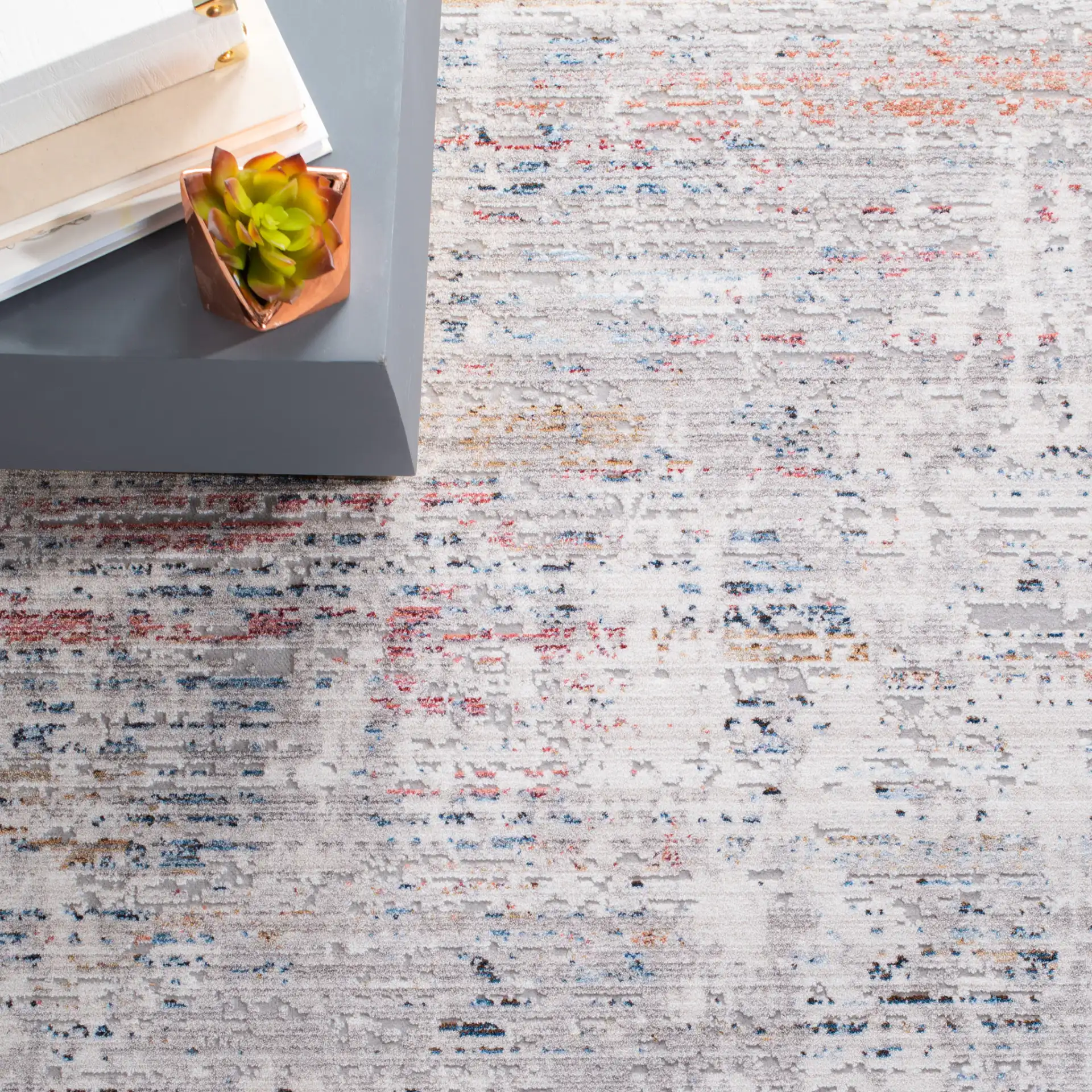 Valencia Abstract Linear Rug in Gray / Blue in a styled room