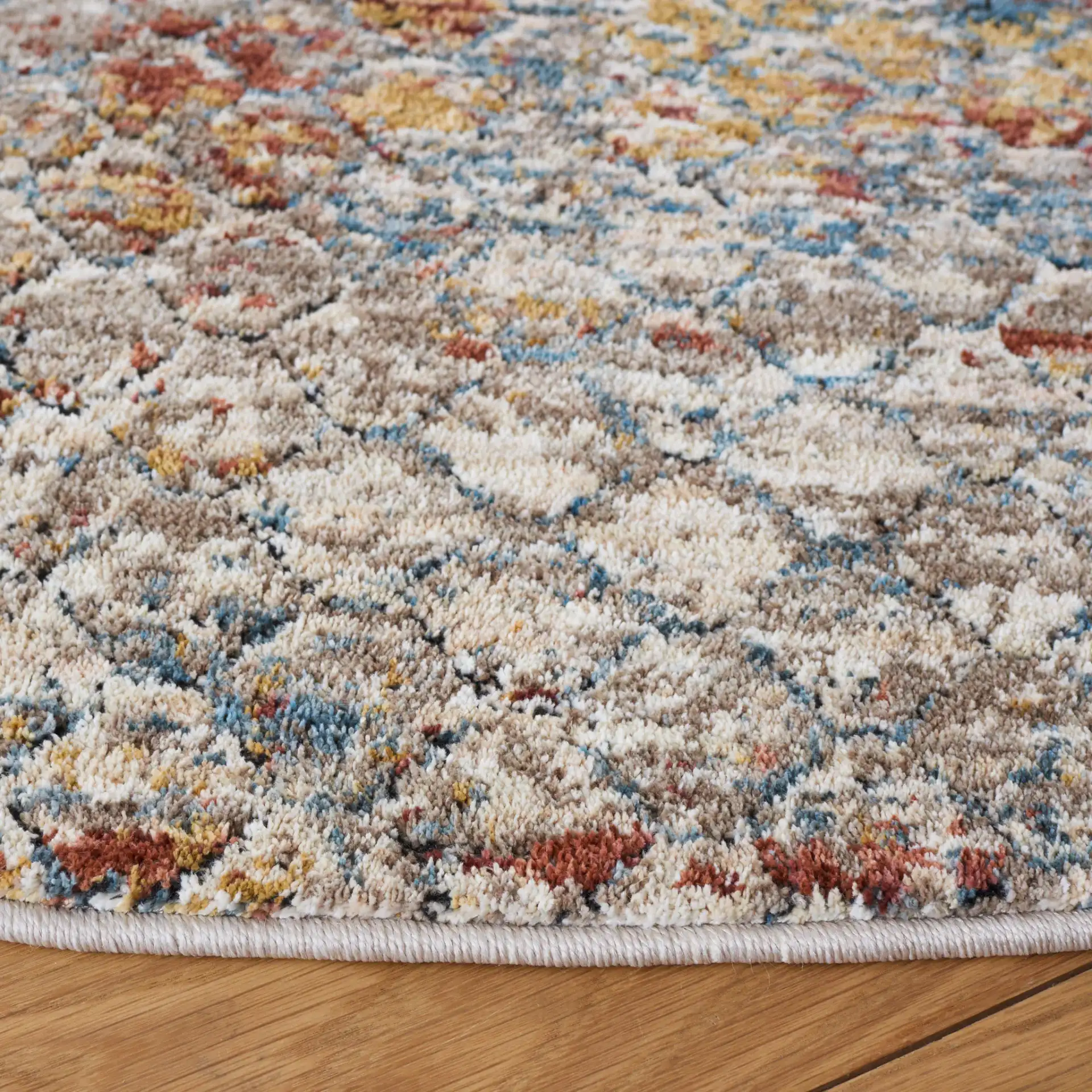 Valencia Distressed Trellis Rug in Beige / Rust in a styled room