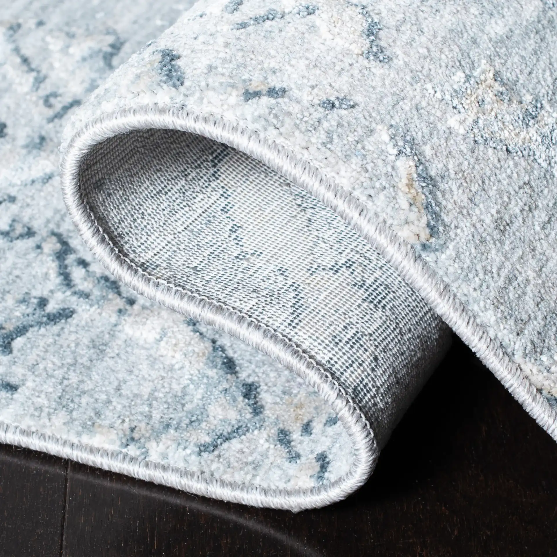 Valencia Distressed Lattice Rug in Light Blue / Gray in a styled room