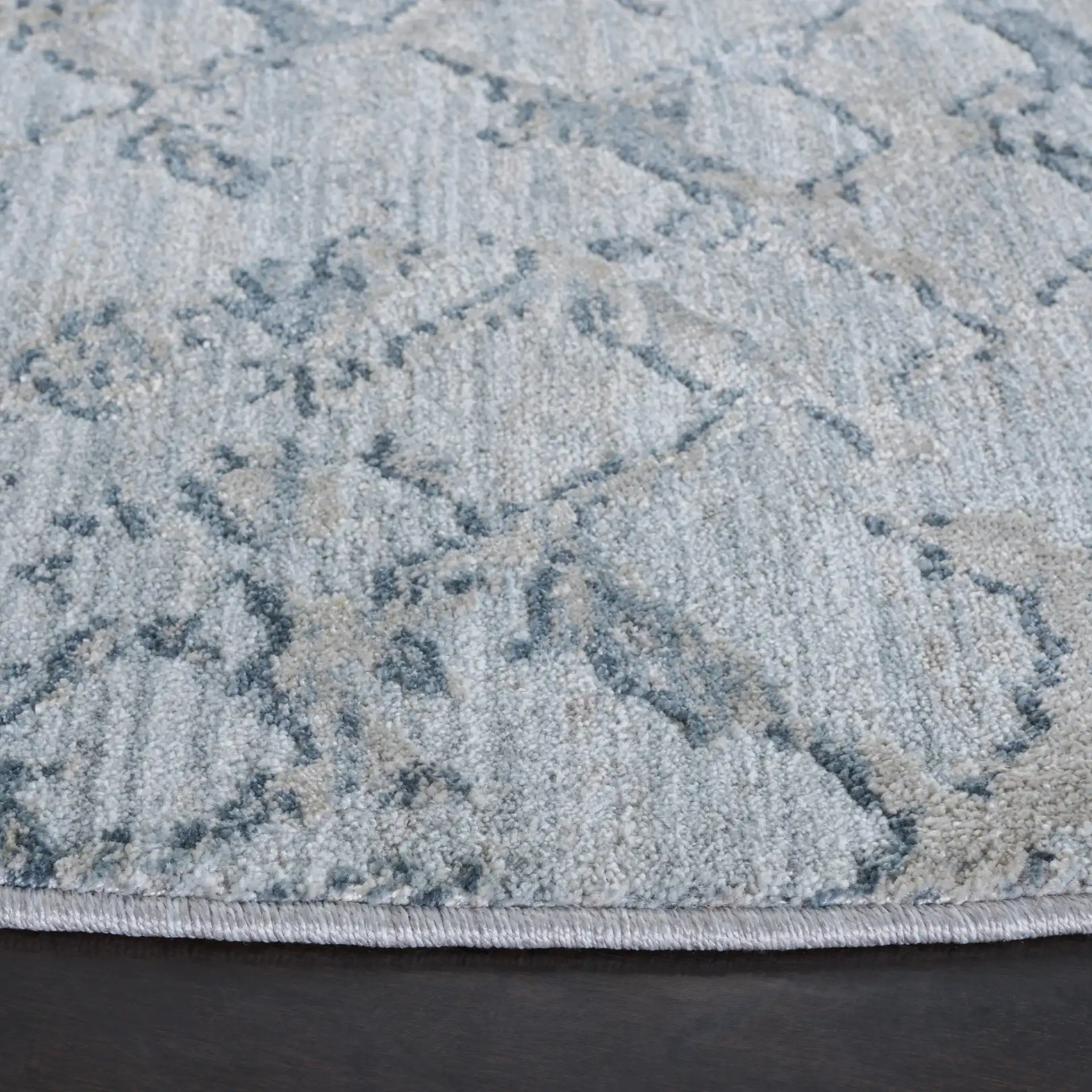 Valencia Distressed Lattice Rug in Light Blue / Gray in a styled room