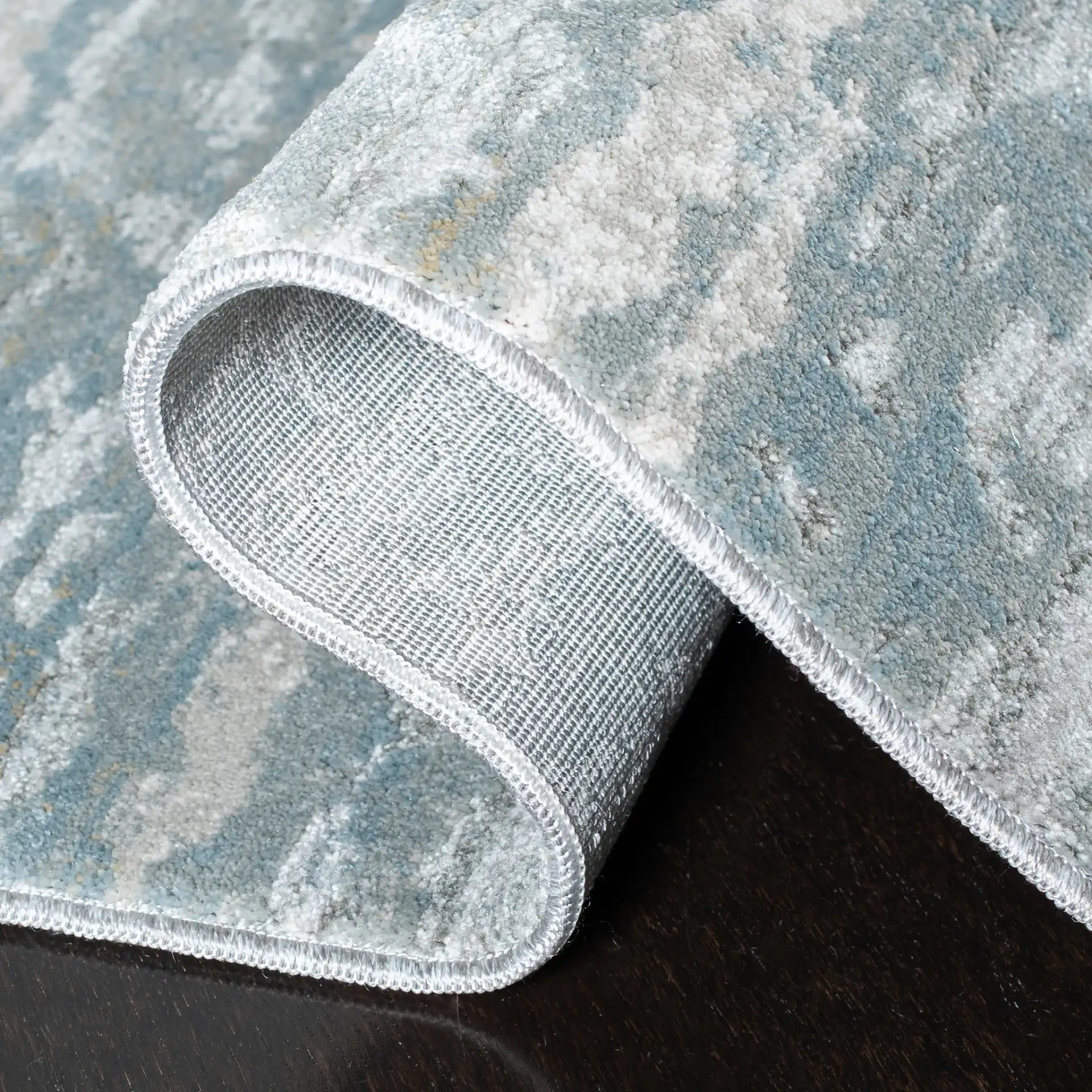 Valencia Allover Abstract Rug in Light Gray / Blue in a styled room