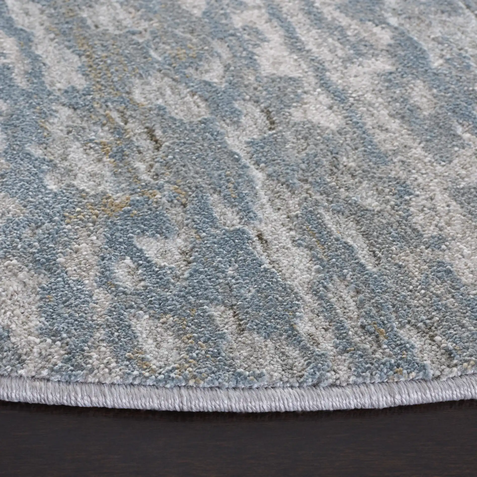 Valencia Allover Abstract Rug in Light Gray / Blue in a styled room