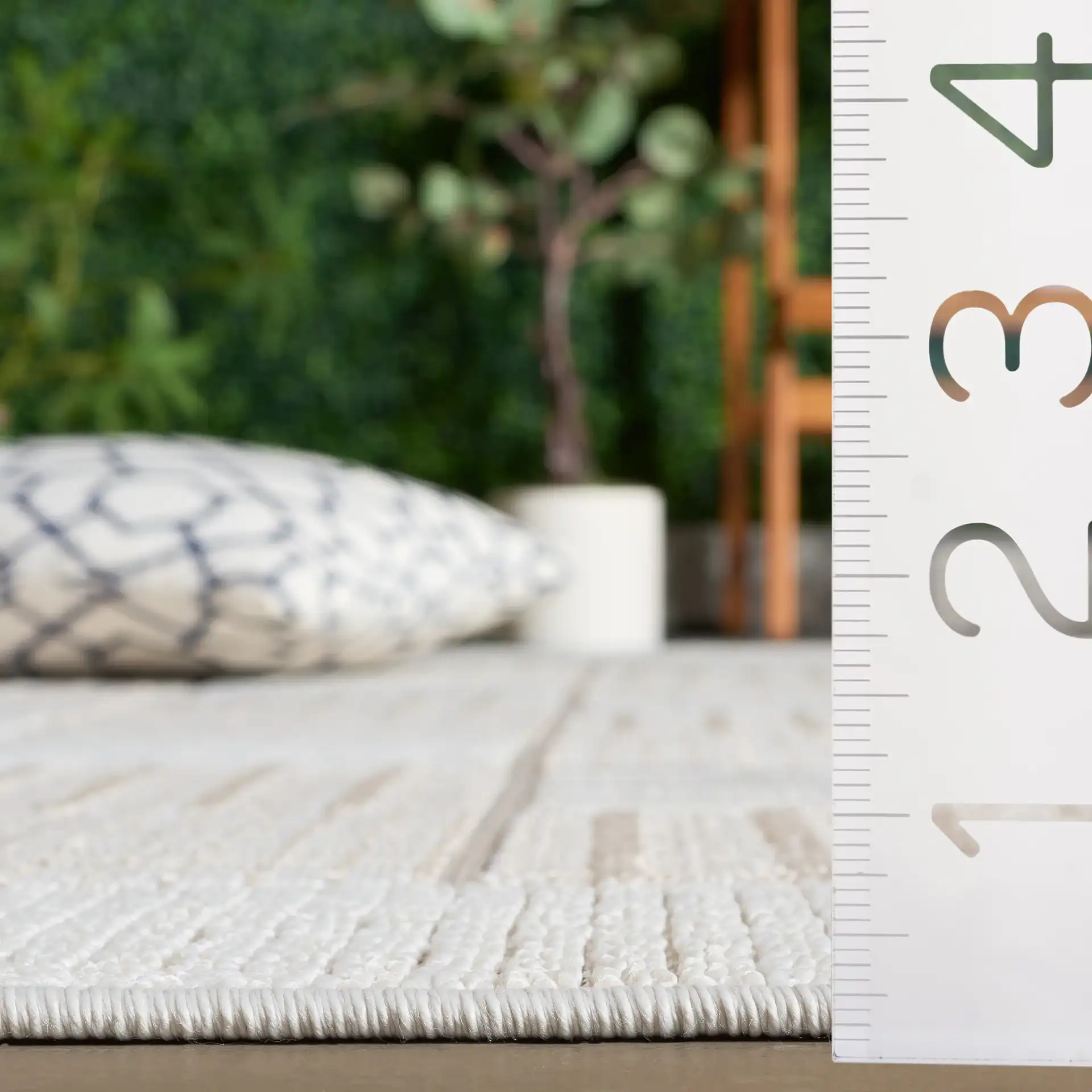 Veranda Checkered Grid Rug in Ivory / Beige in a styled room