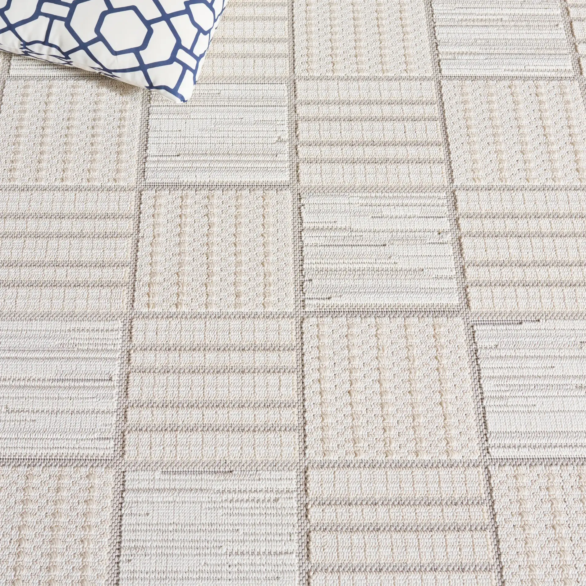 Veranda Checkered Grid Rug in Ivory / Beige in a styled room