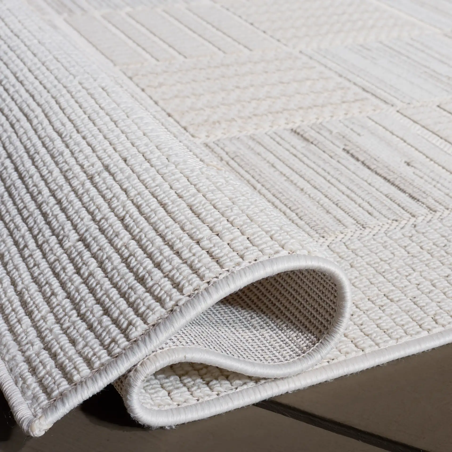 Veranda Checkered Grid Rug in Ivory / Beige in a styled room