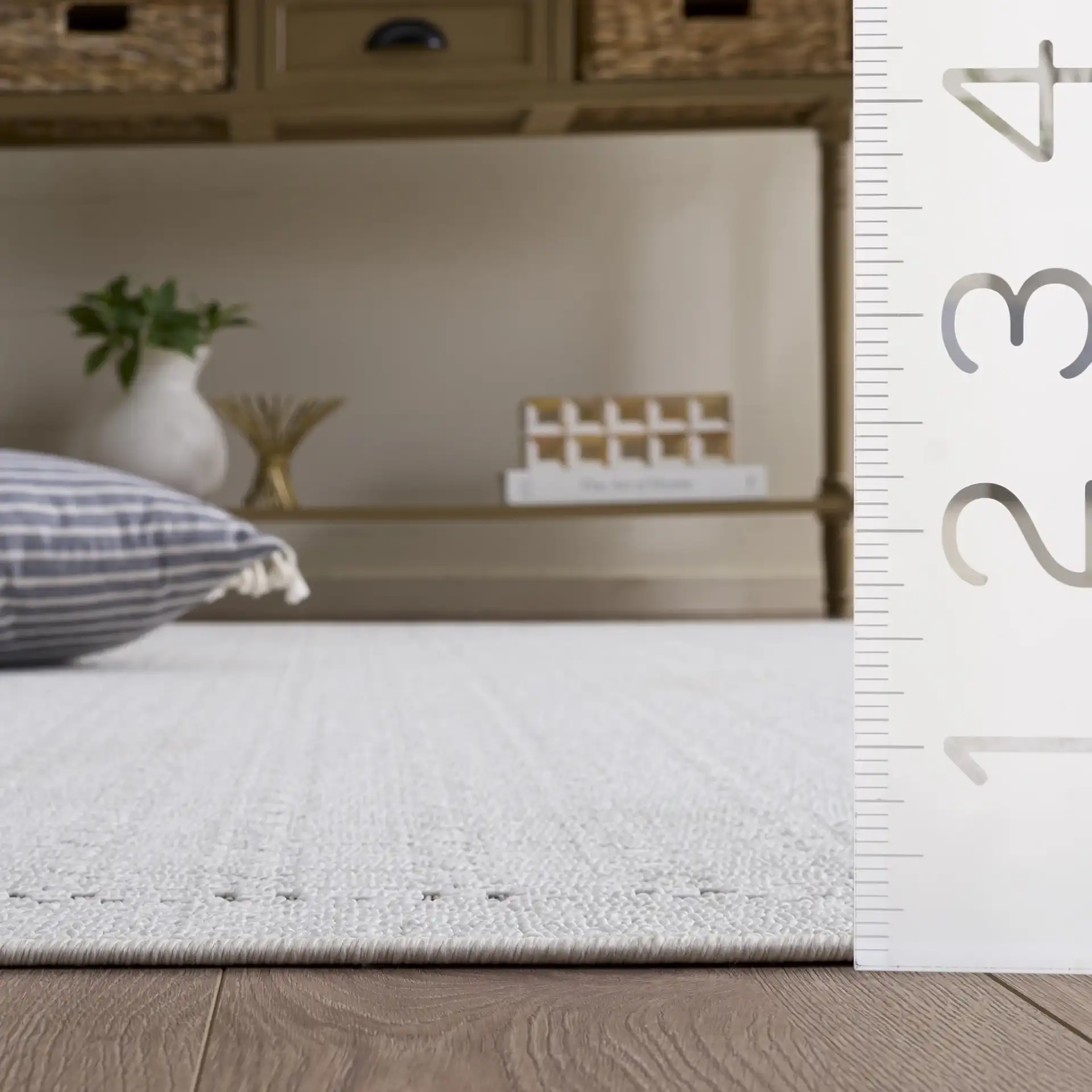 Veranda Grid Border Rug in Ivory / Dark Gray in a styled room