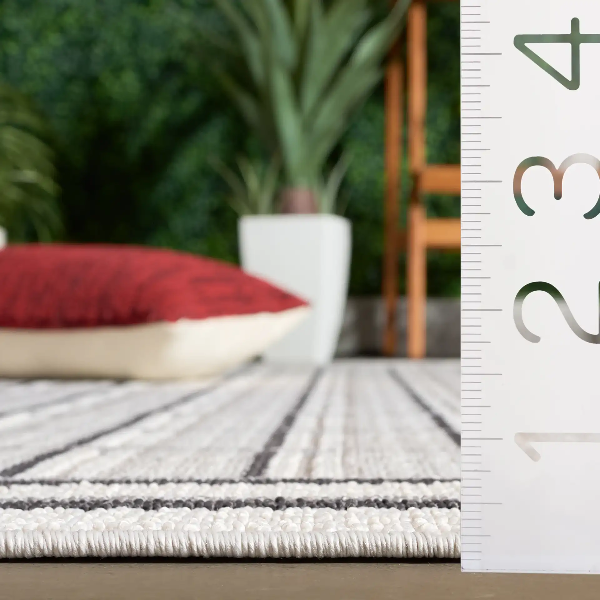 Veranda Grid Rug in Gray / Dark Gray in a styled room
