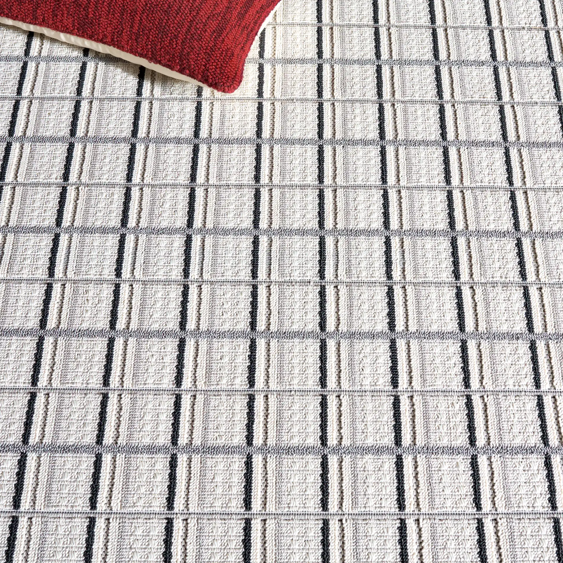 Veranda Grid Rug in Gray / Dark Gray in a styled room