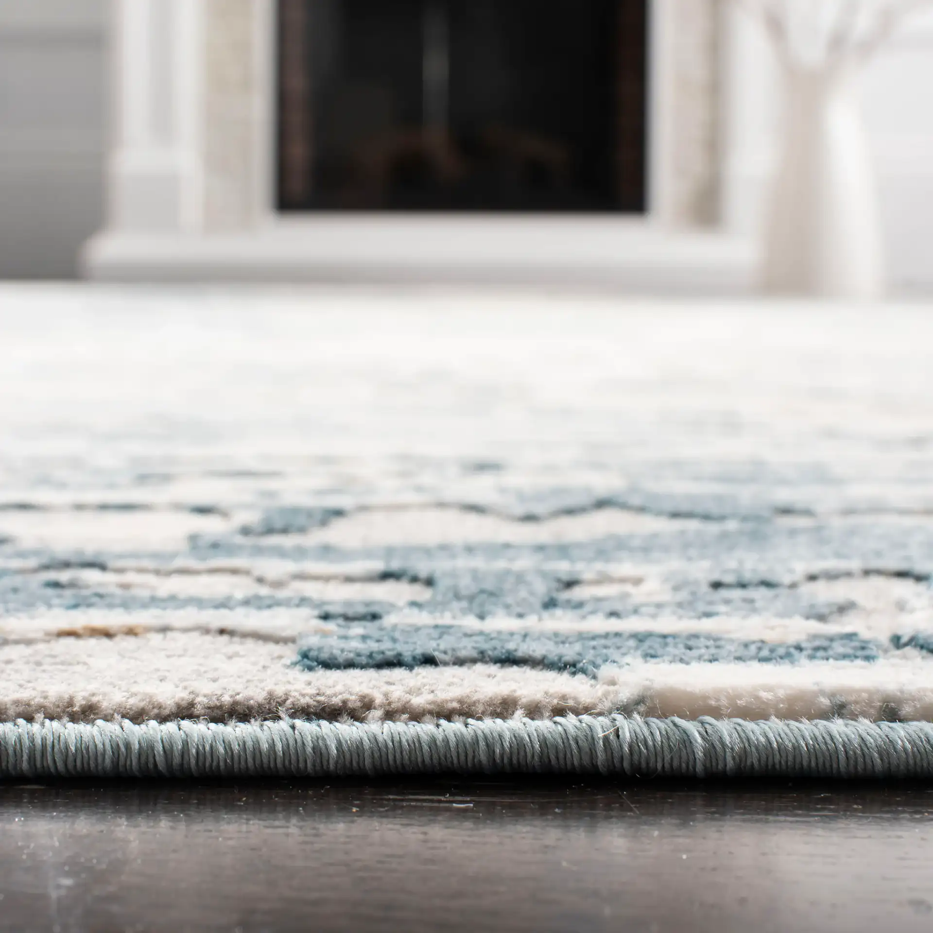 Vogue Abstract Striations Rug in Ivory / Teal in a styled room