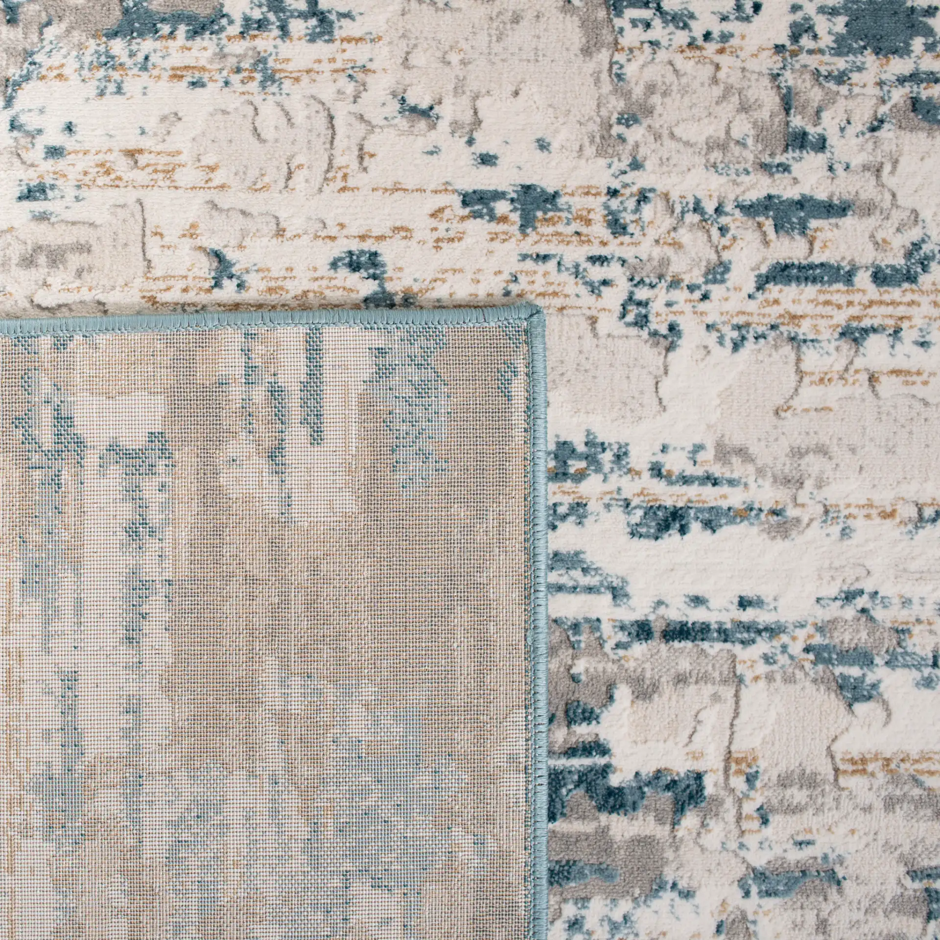 Vogue Abstract Striations Rug in Ivory / Teal in a styled room
