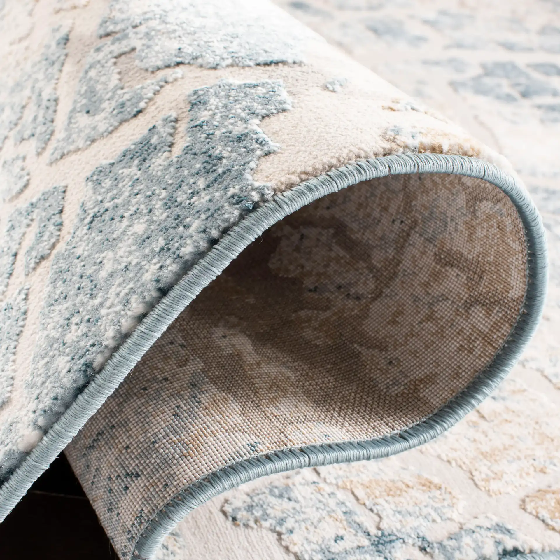 Vogue Concentric Ring Rug in Ivory / Teal in a styled room