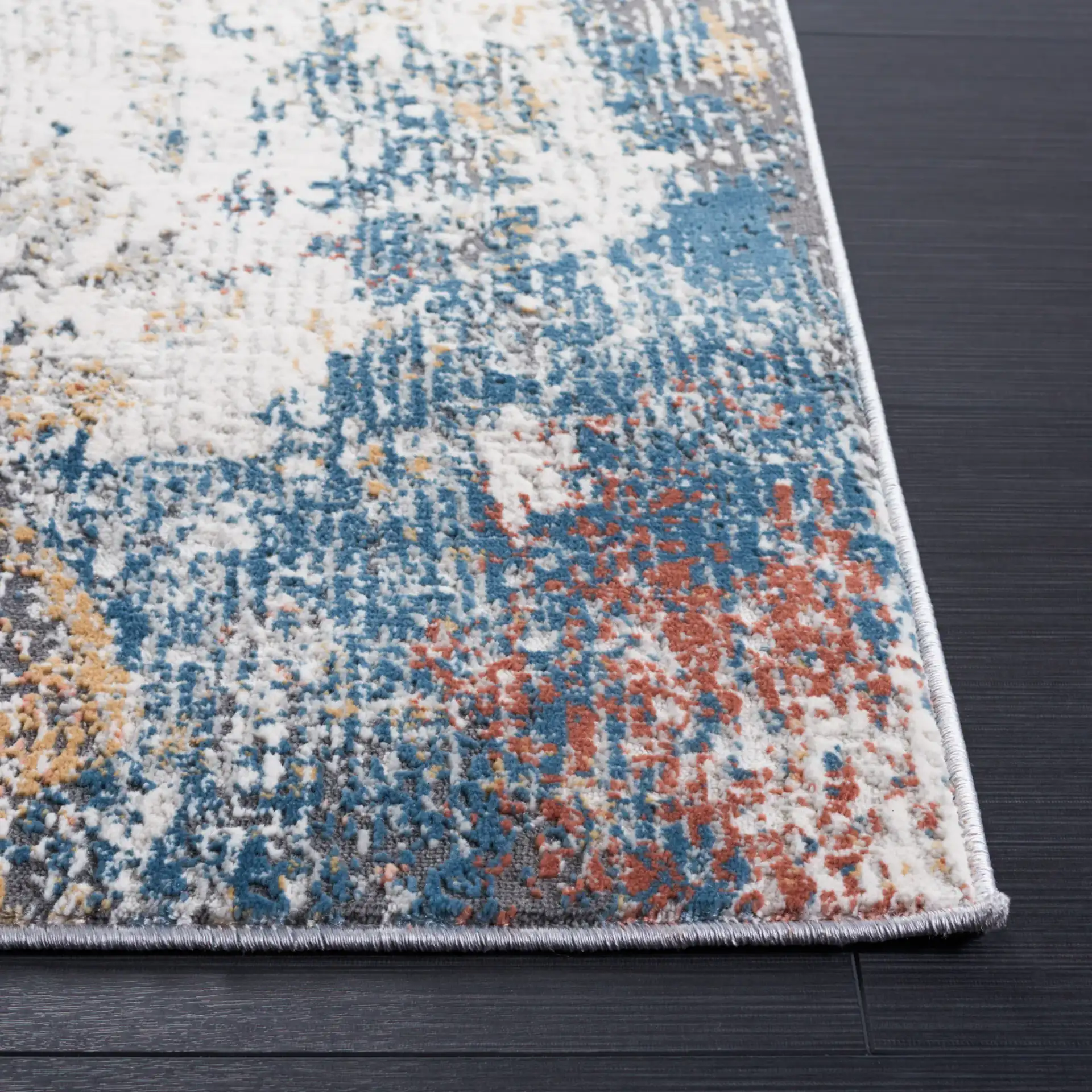 Vogue Abstract Wash Rug in Ivory / Blue Rust in a styled room