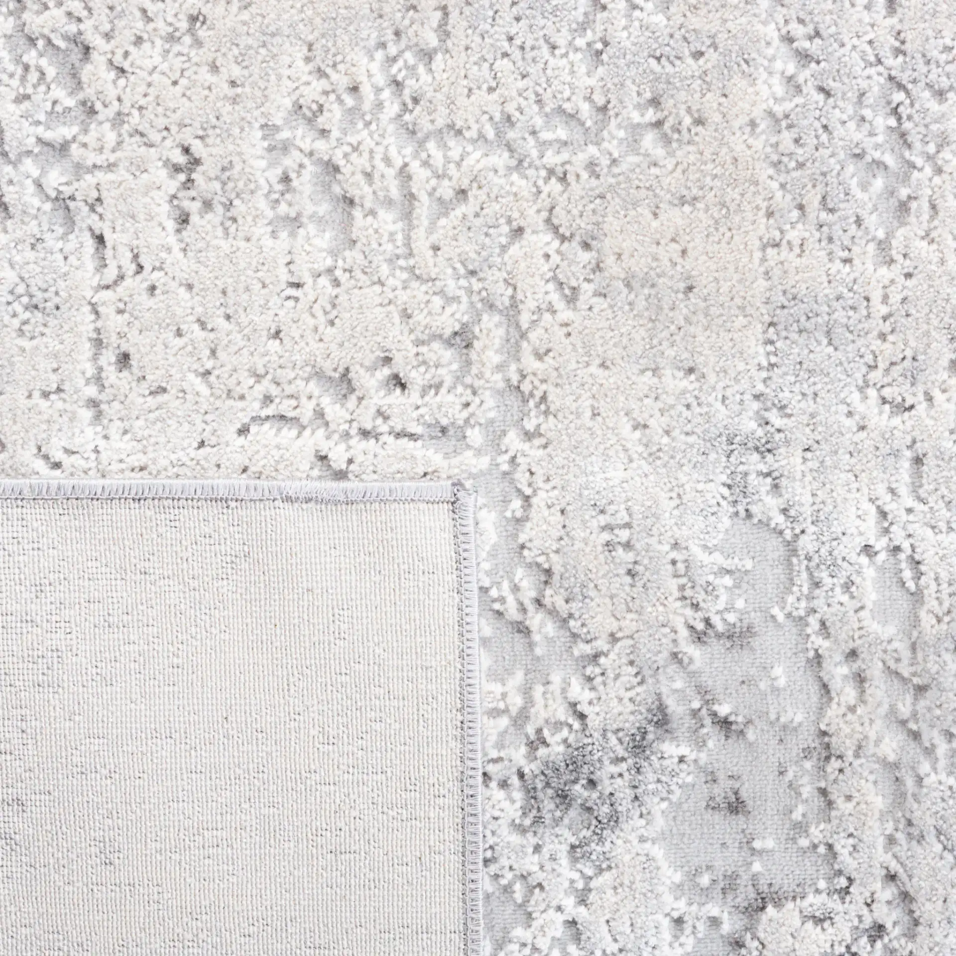 Vogue Weathered Abstract Rug in Gray / Light Gray in a styled room