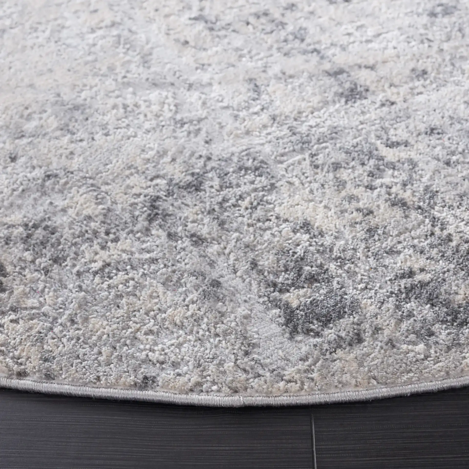Vogue Weathered Abstract Rug in Gray / Light Gray in a styled room