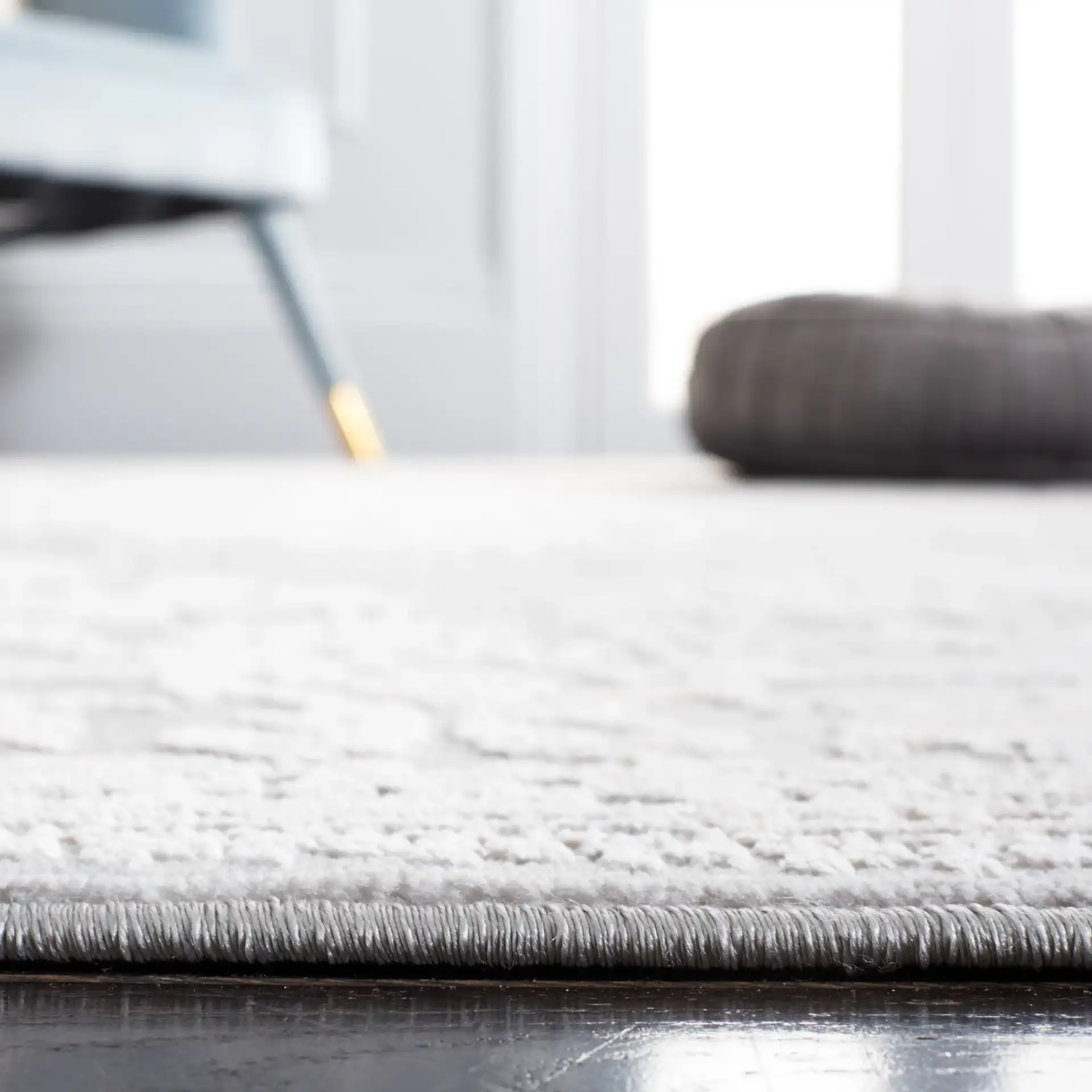 Vogue Floral Medallion Rug in Gray / Light Gray in a styled room