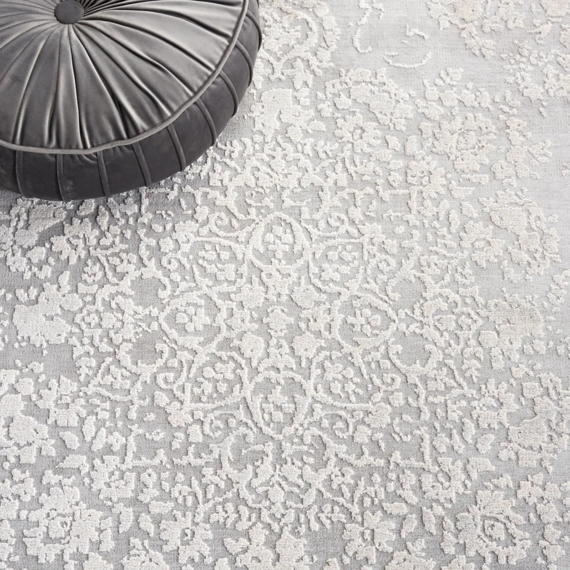 Vogue Floral Medallion Rug in Gray / Light Gray in a styled room