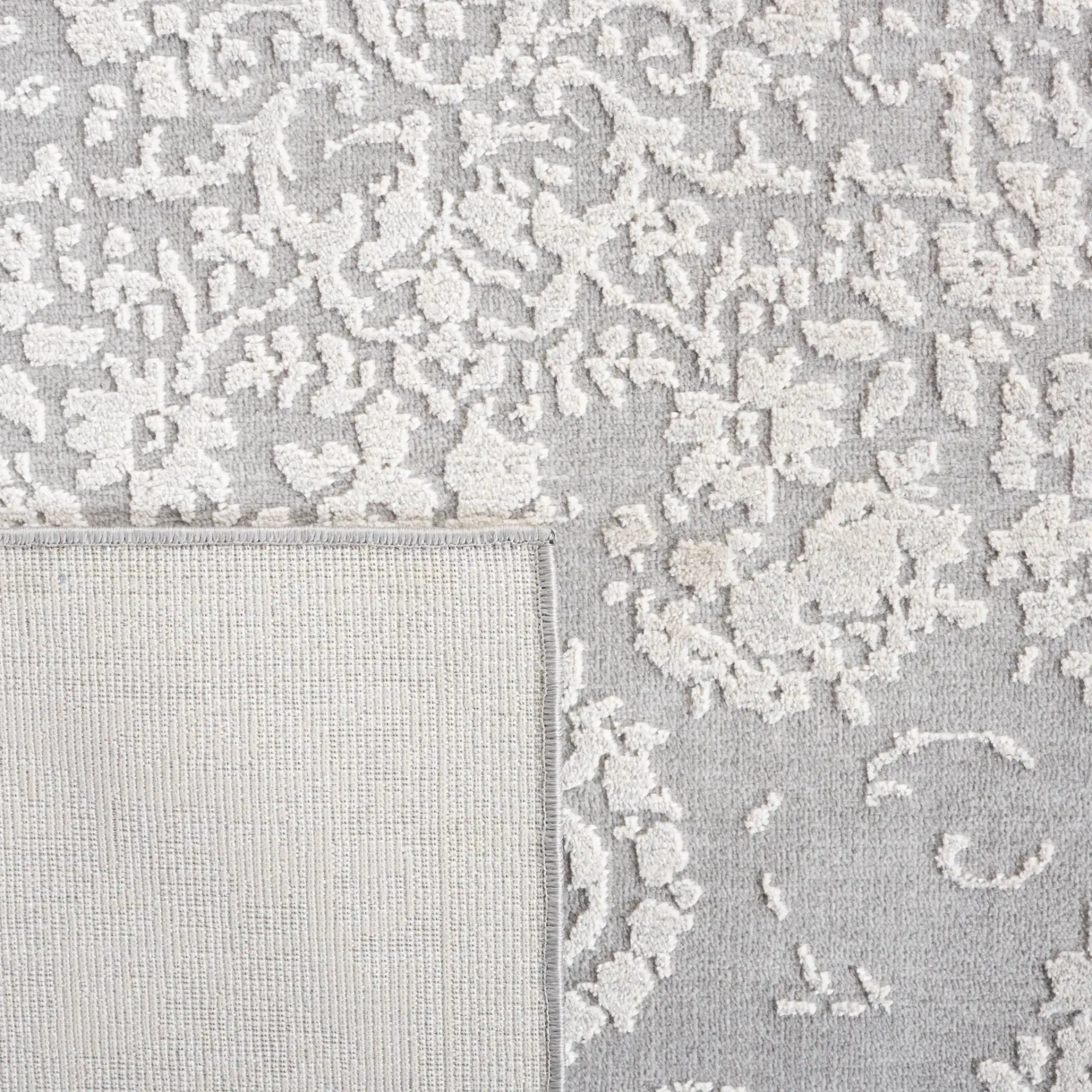 Vogue Floral Medallion Rug in Gray / Light Gray in a styled room