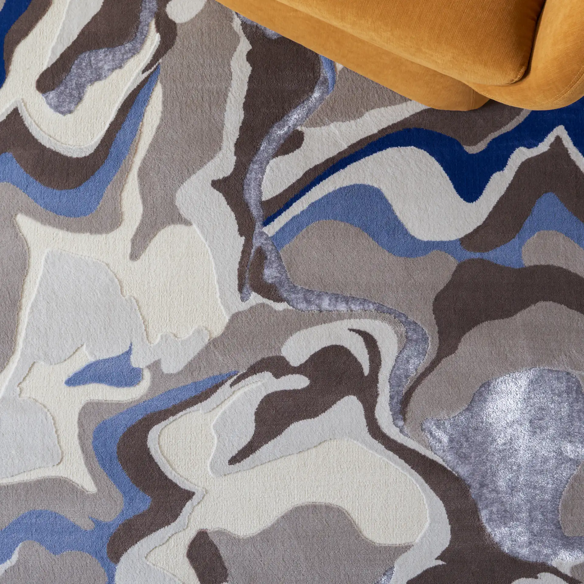 Vogue Fluid Wave Rug in Taupe / Blue in a styled room