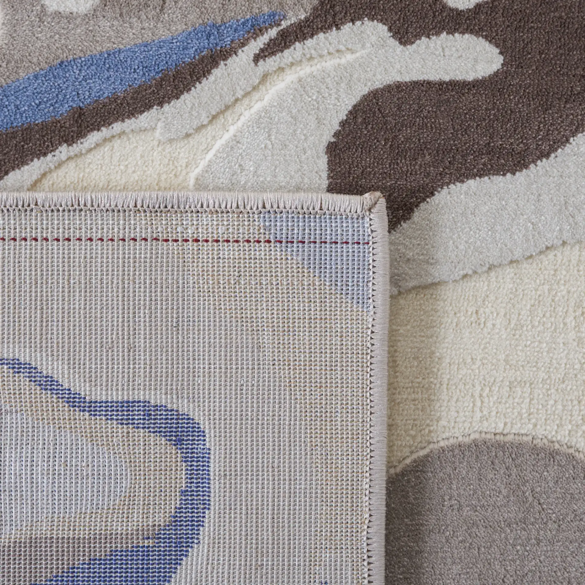 Vogue Fluid Wave Rug in Taupe / Blue in a styled room