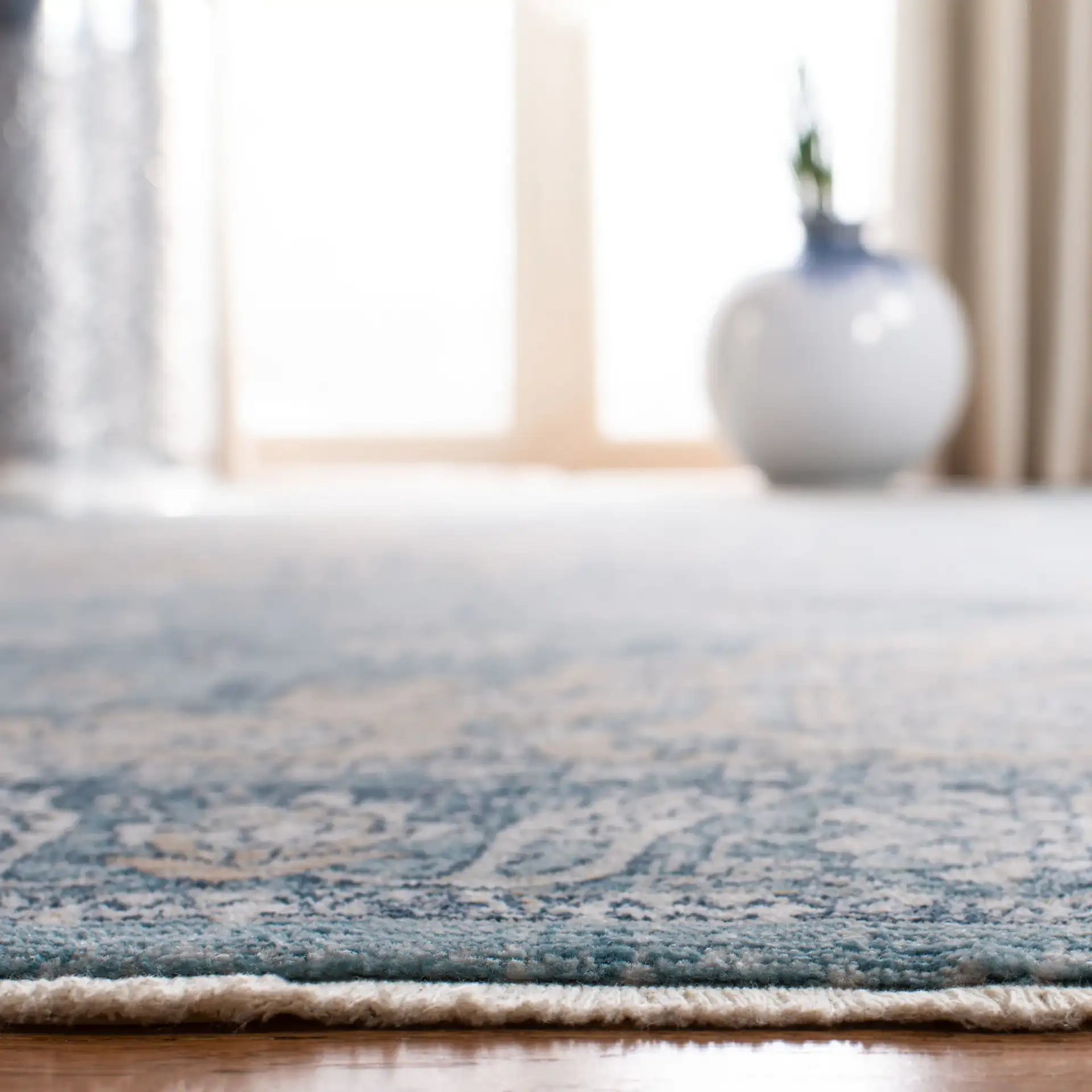 Victoria Floral Medallion Rug in Blue / Gray in a styled room