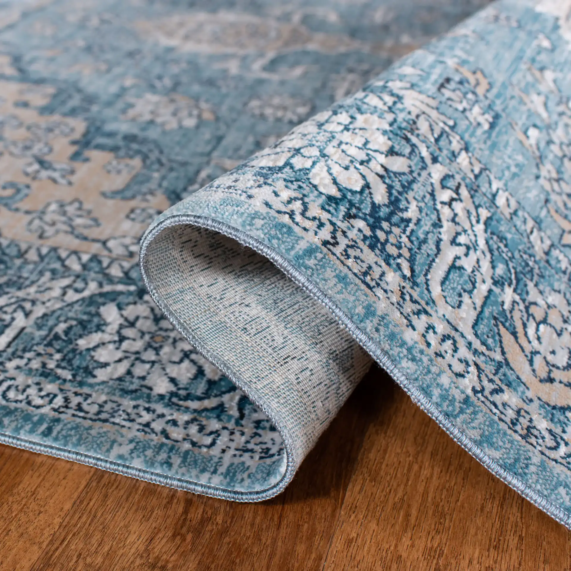 Victoria Floral Medallion Rug in Blue / Gray in a styled room