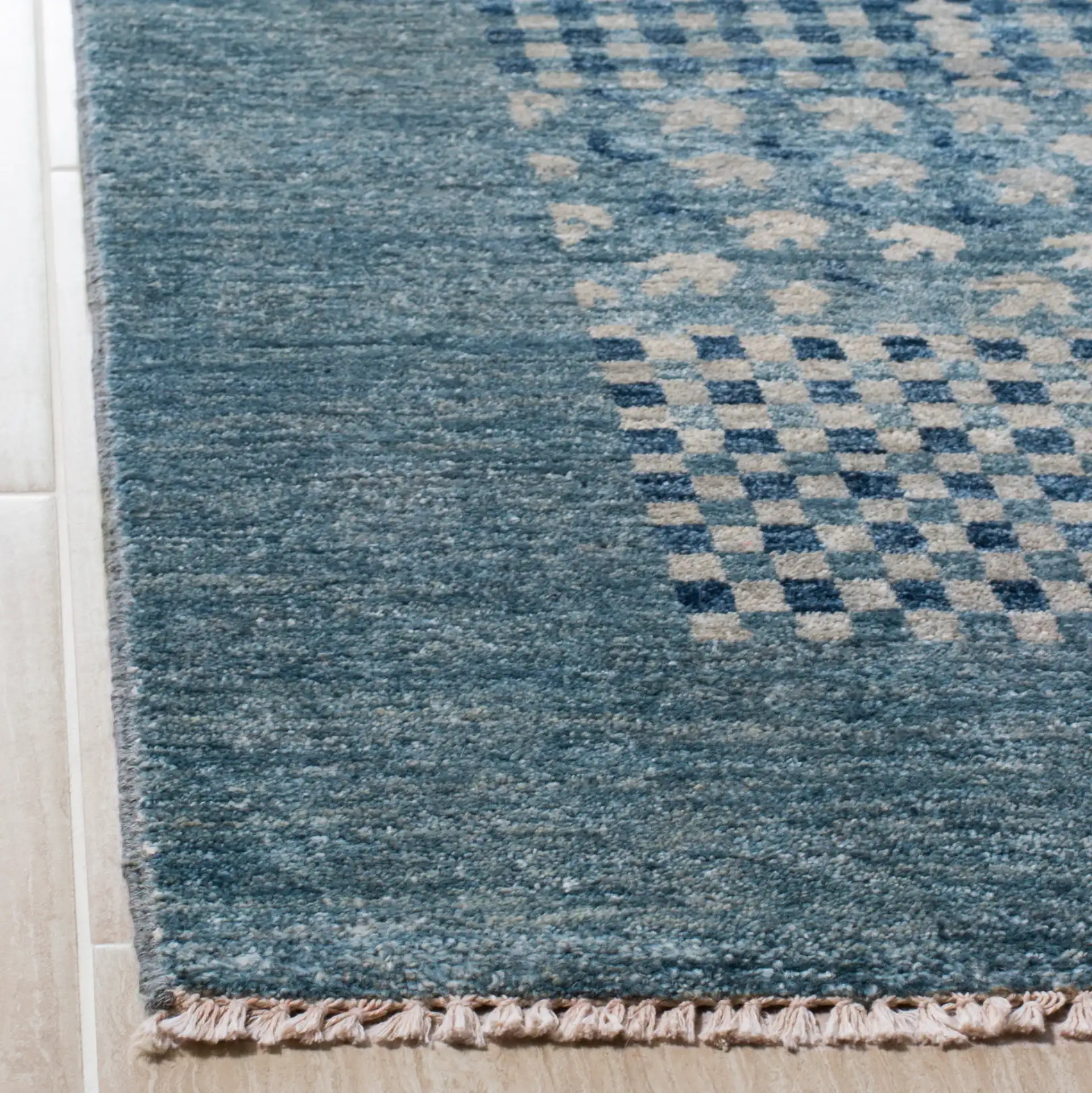 Vineyard Banded Checkerboard Wool Rug in Blue in a styled room