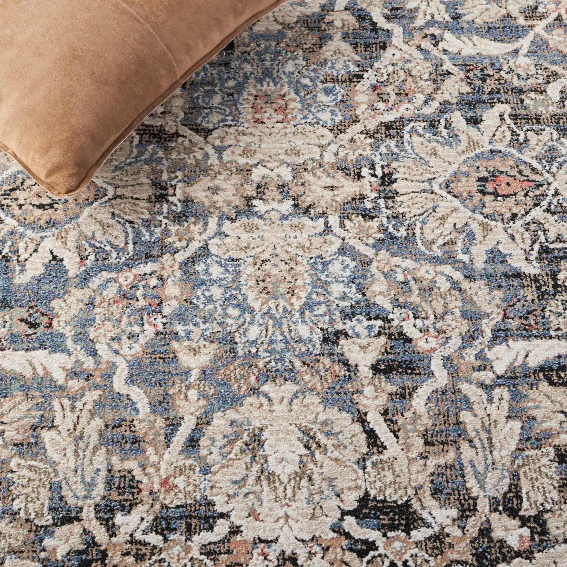 Vivaldi Bordered Floral Rug in Navy / Ivory in a styled room