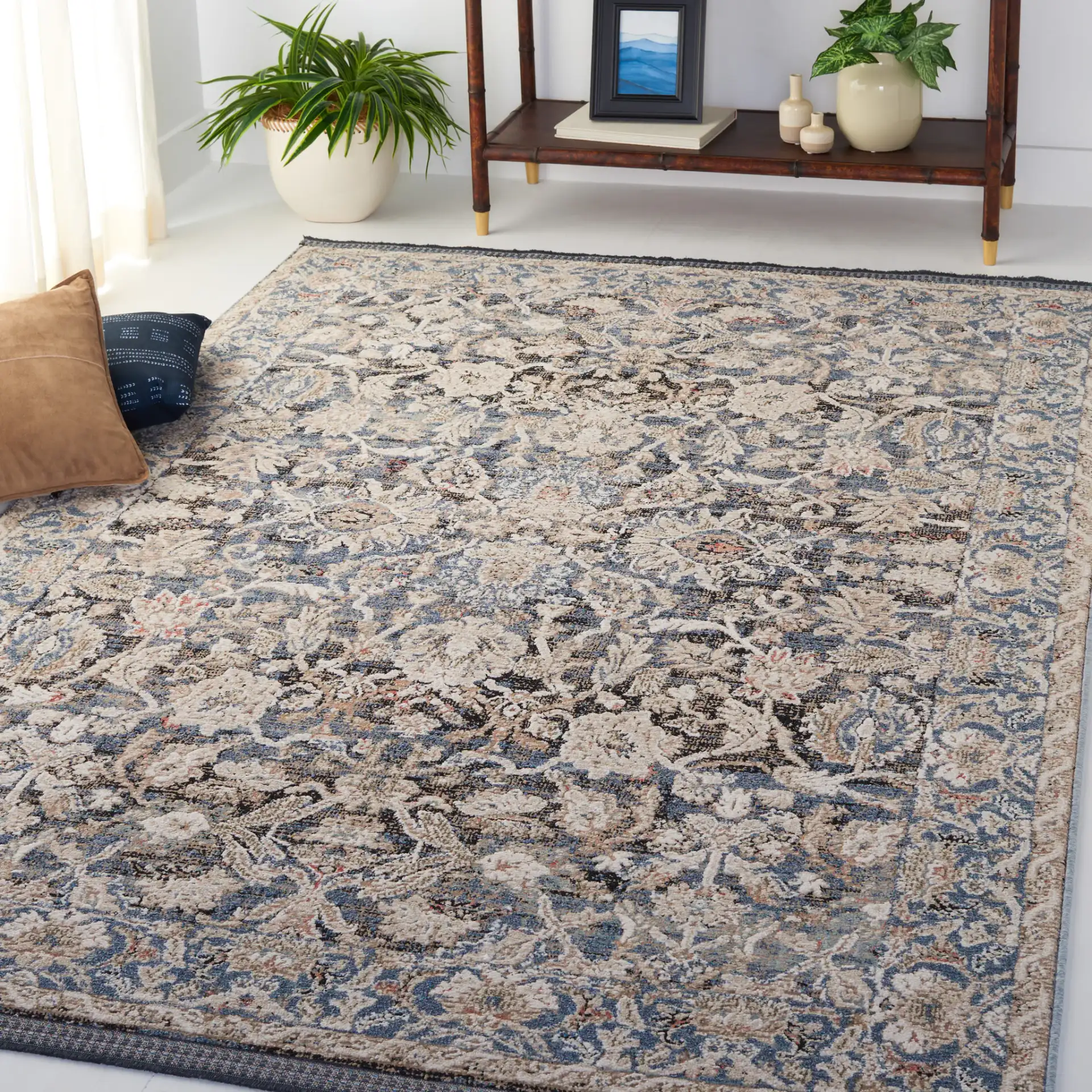 Vivaldi Bordered Floral Rug in Navy / Ivory in a styled room