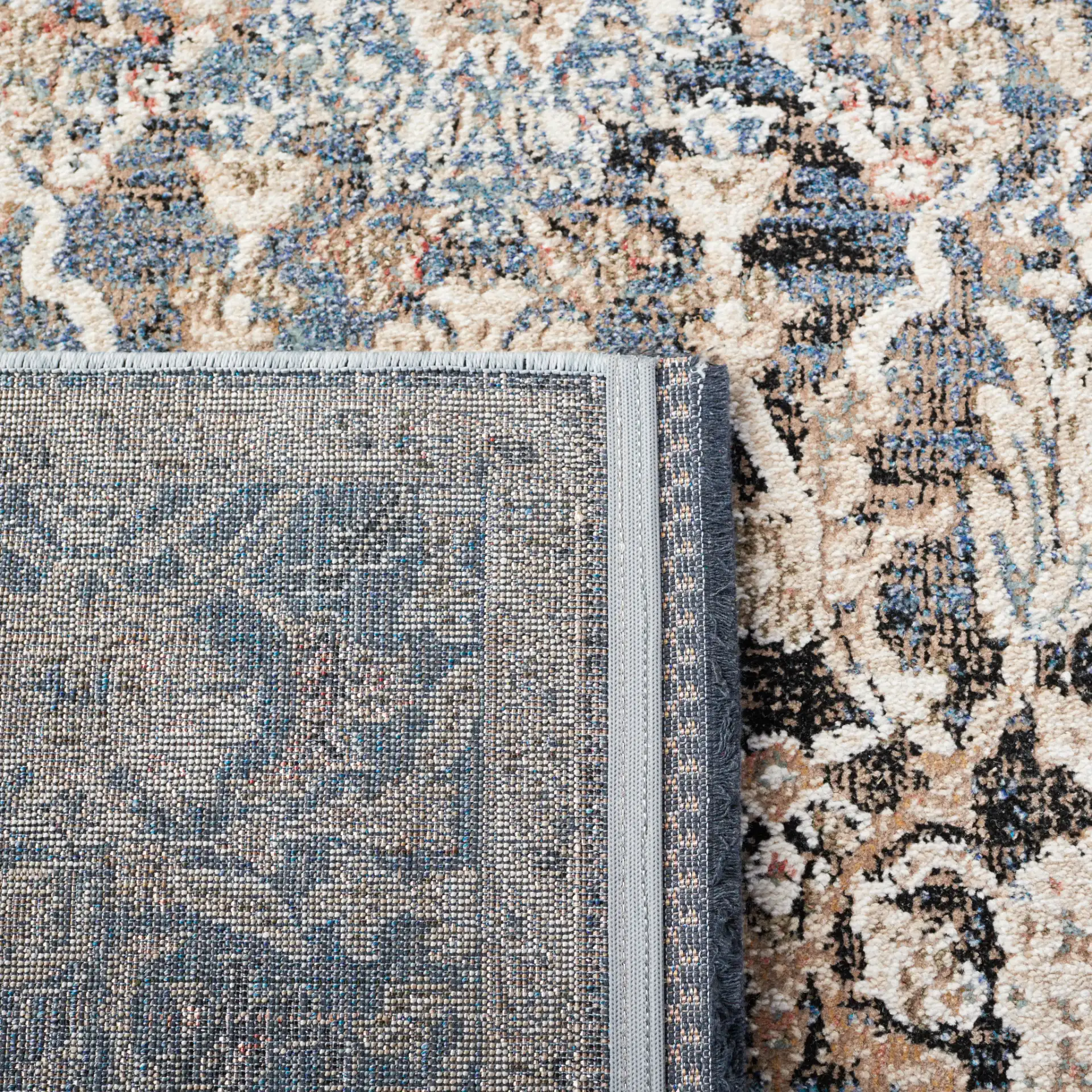 Vivaldi Bordered Floral Rug in Navy / Ivory in a styled room