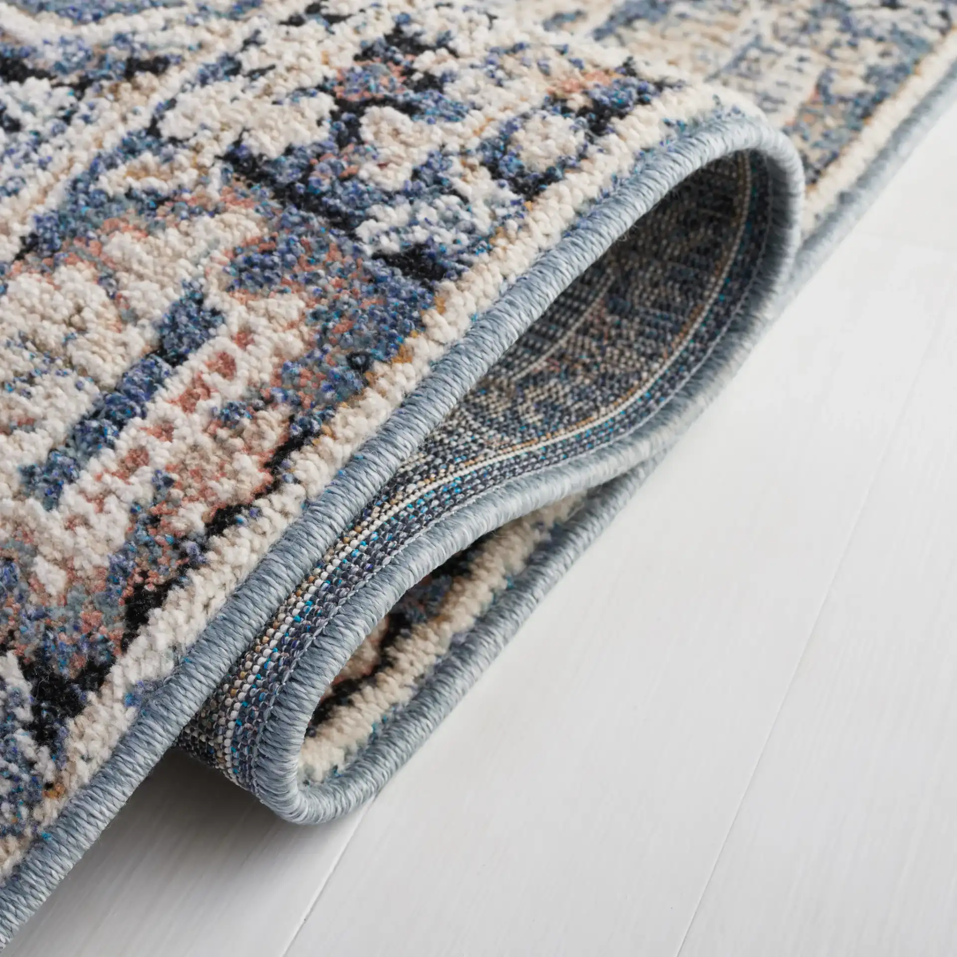 Vivaldi Floral Vine Rug in Navy / Ivory in a styled room