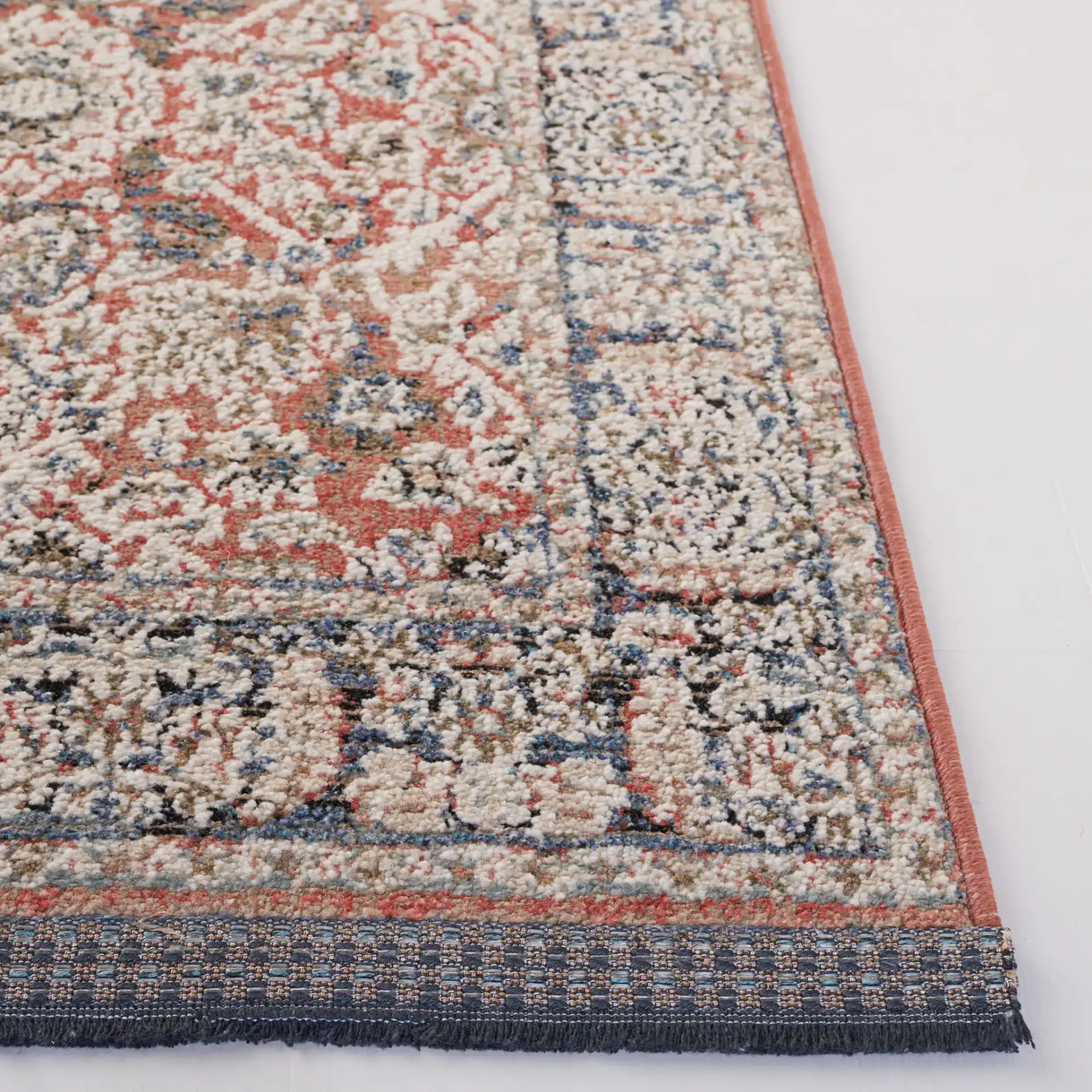 Vivaldi Bordered Traditional Rug in Navy / Rust in a styled room