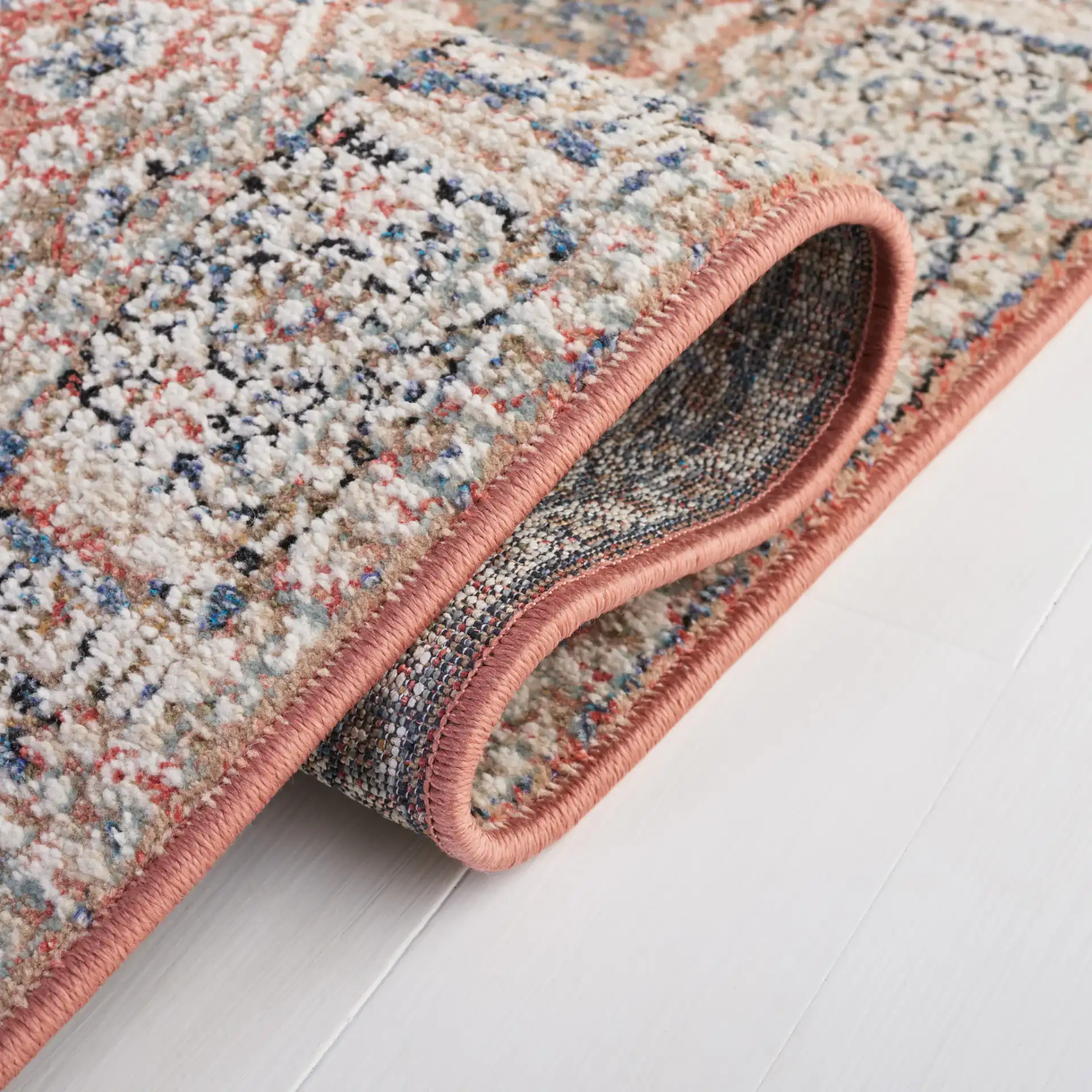 Vivaldi Bordered Traditional Rug in Navy / Rust in a styled room