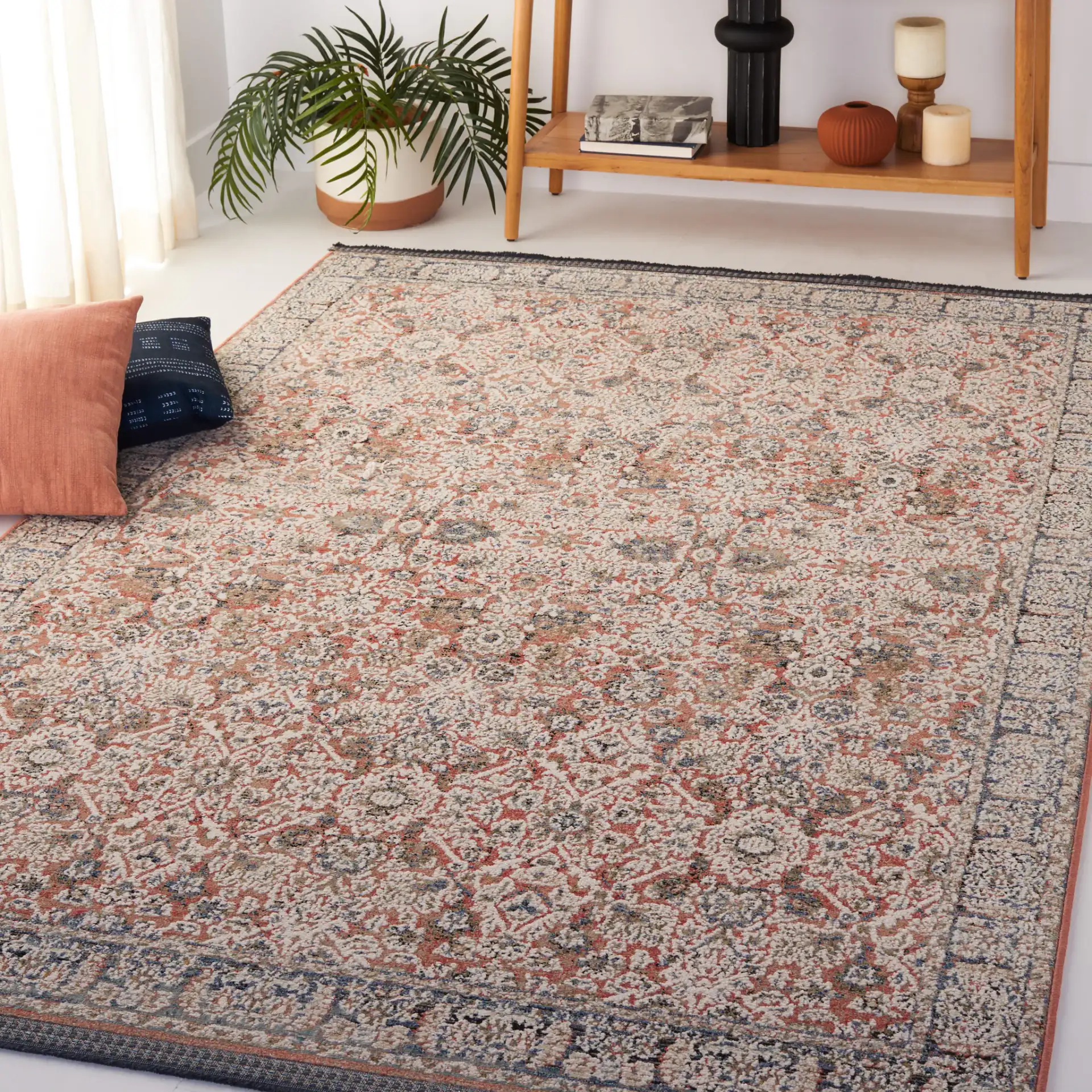 Vivaldi Bordered Traditional Rug in Navy / Rust in a styled room